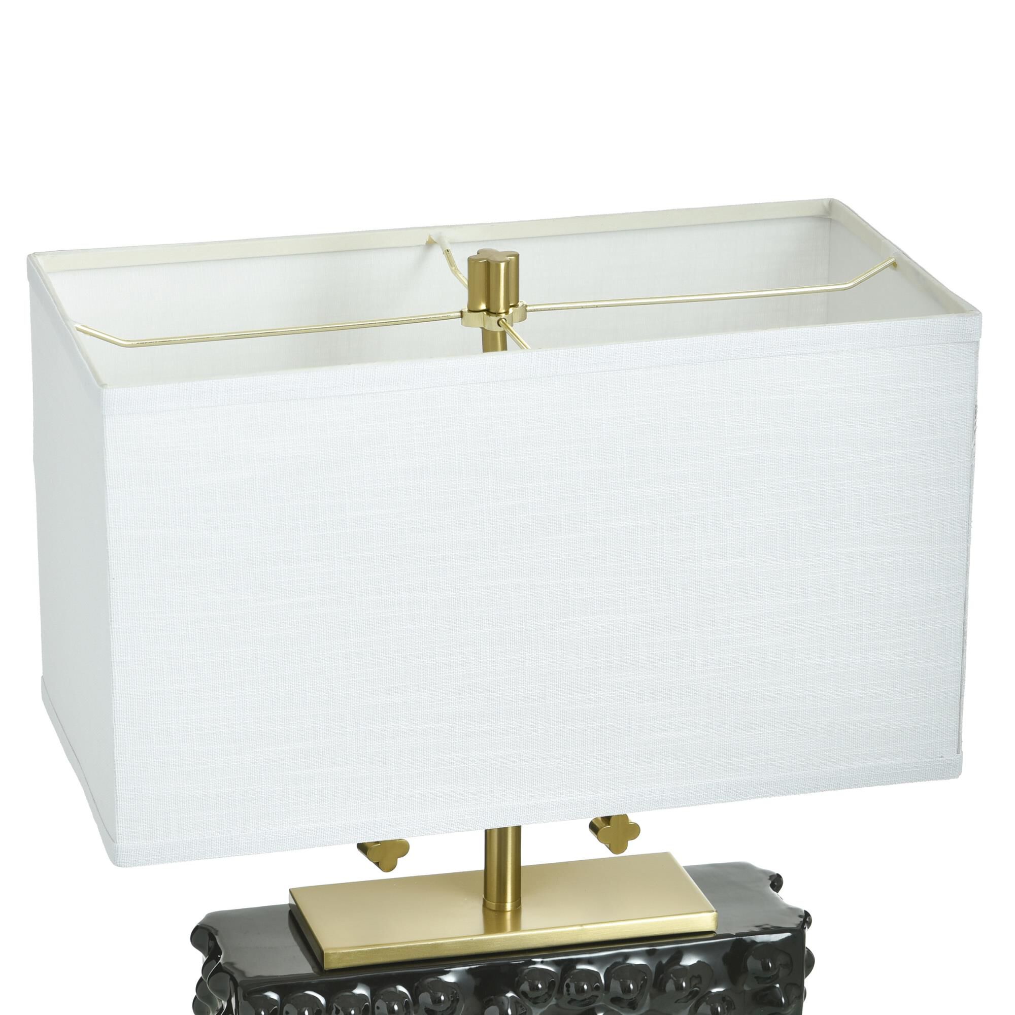 Shown in Polished Brass and Glossy Black finish and Off-White shade