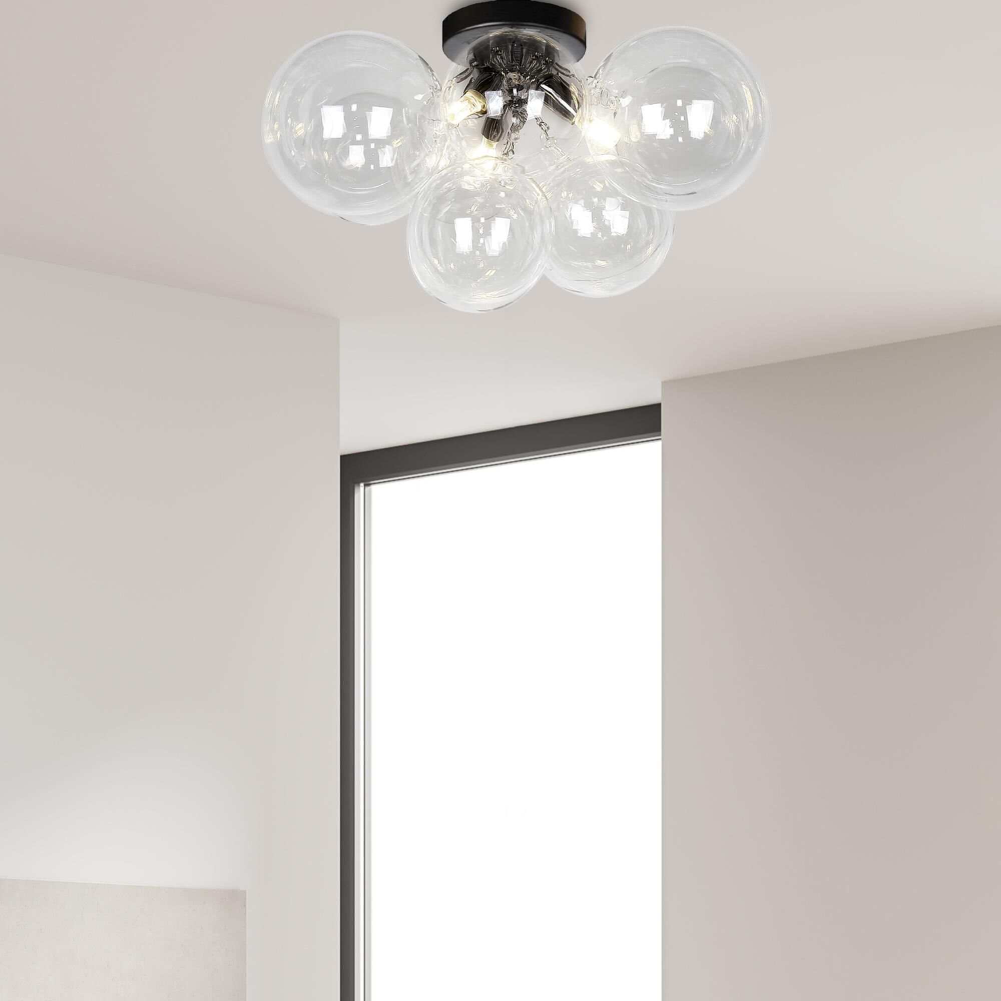 Shown in Matte Black finish and Clear Globe glass