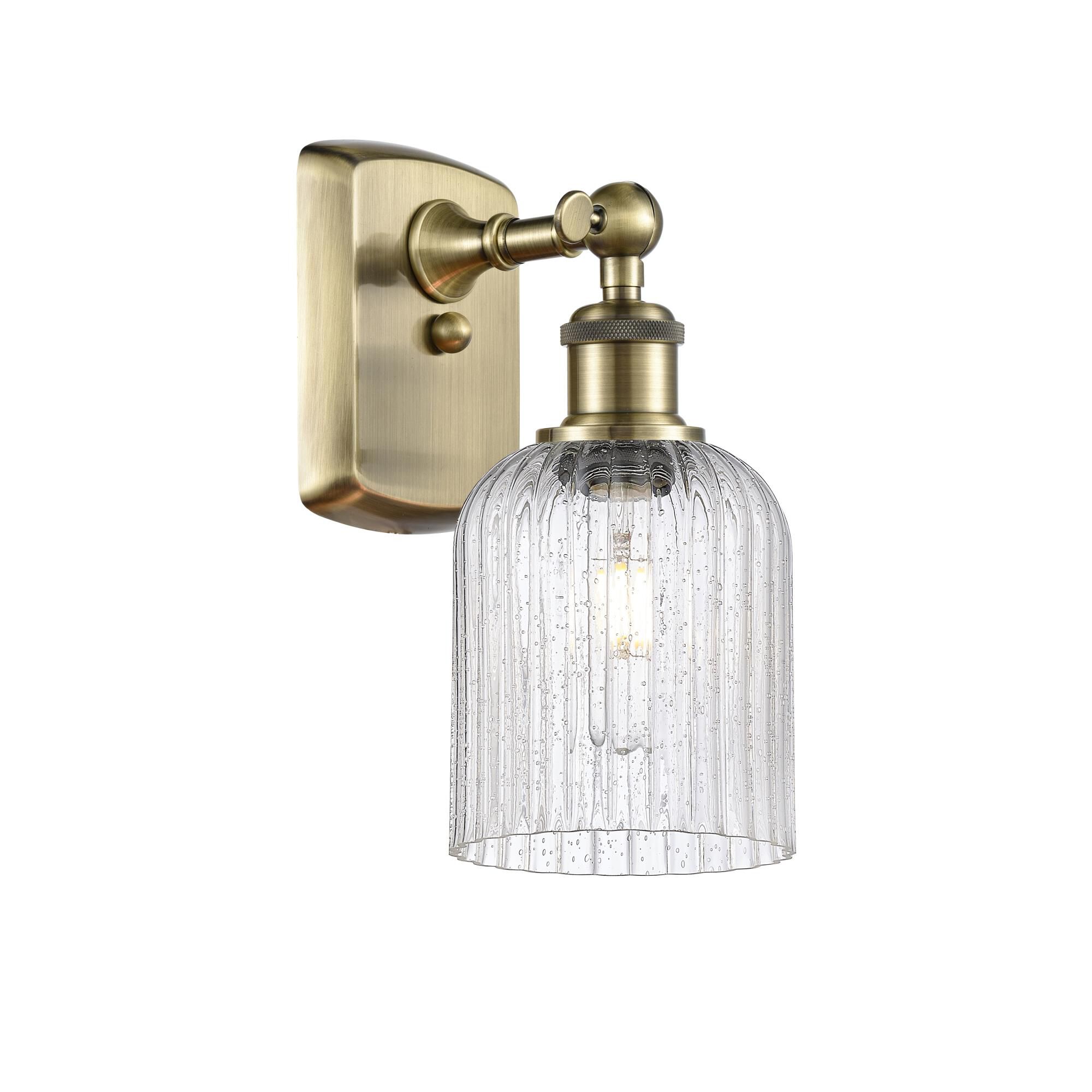 Shown in Antique Brass finish and Seedy shade