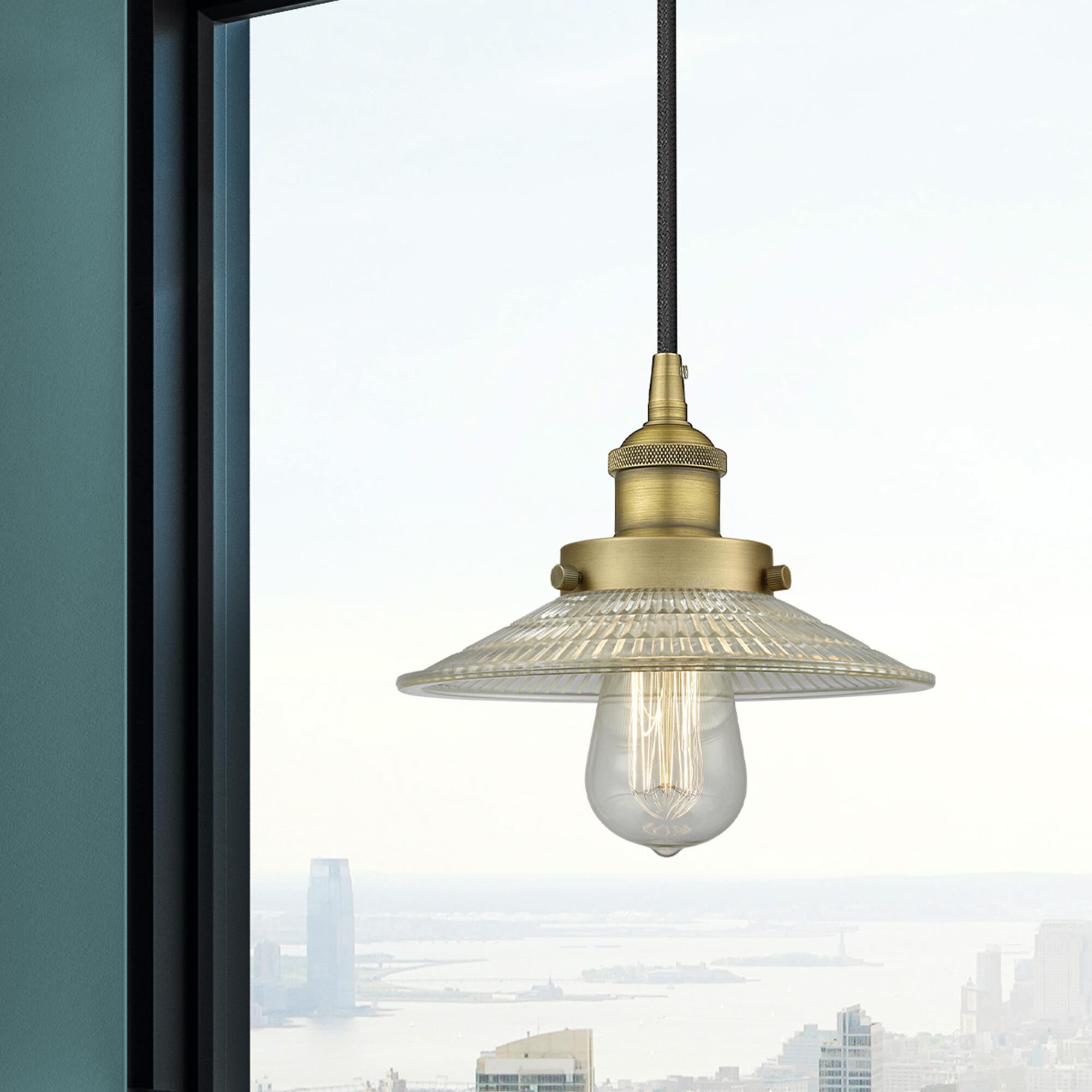 Shown in Brushed Brass finish and Clear glass