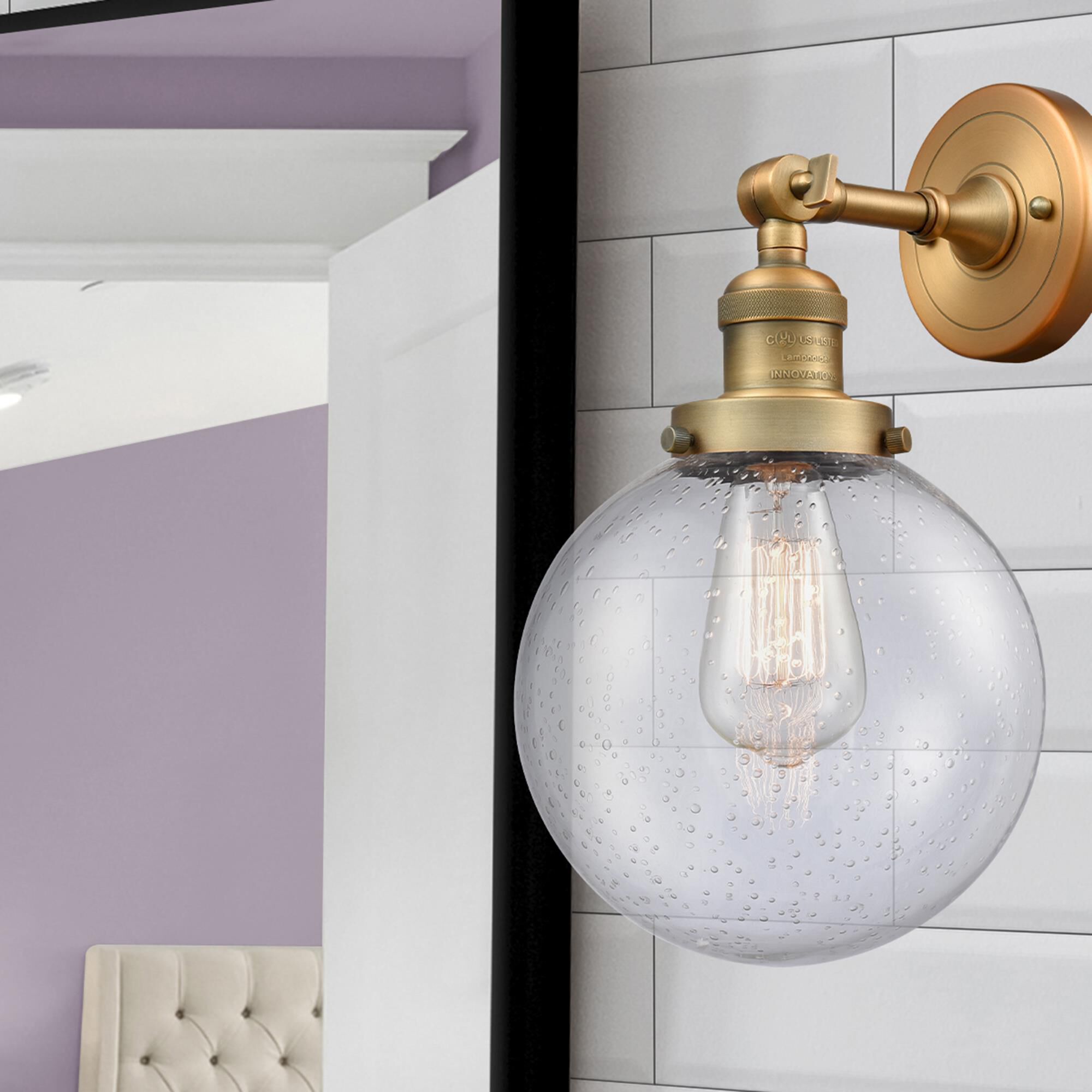 Shown in Brushed Brass finish and Seedy glass and No Accent accent