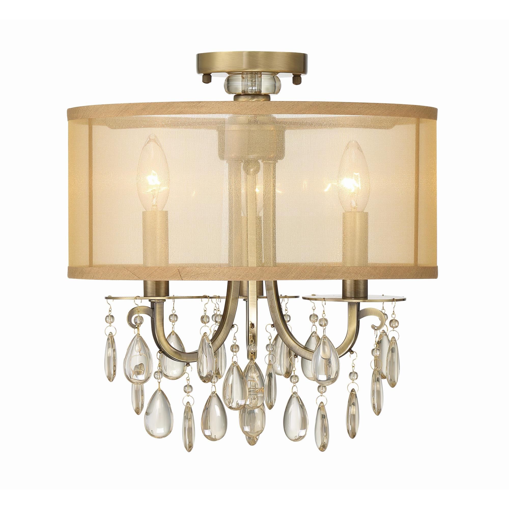 Shown in Antique Brass finish and Etruscan Teardrop Almond crystal and Silk glass and Silk shade
