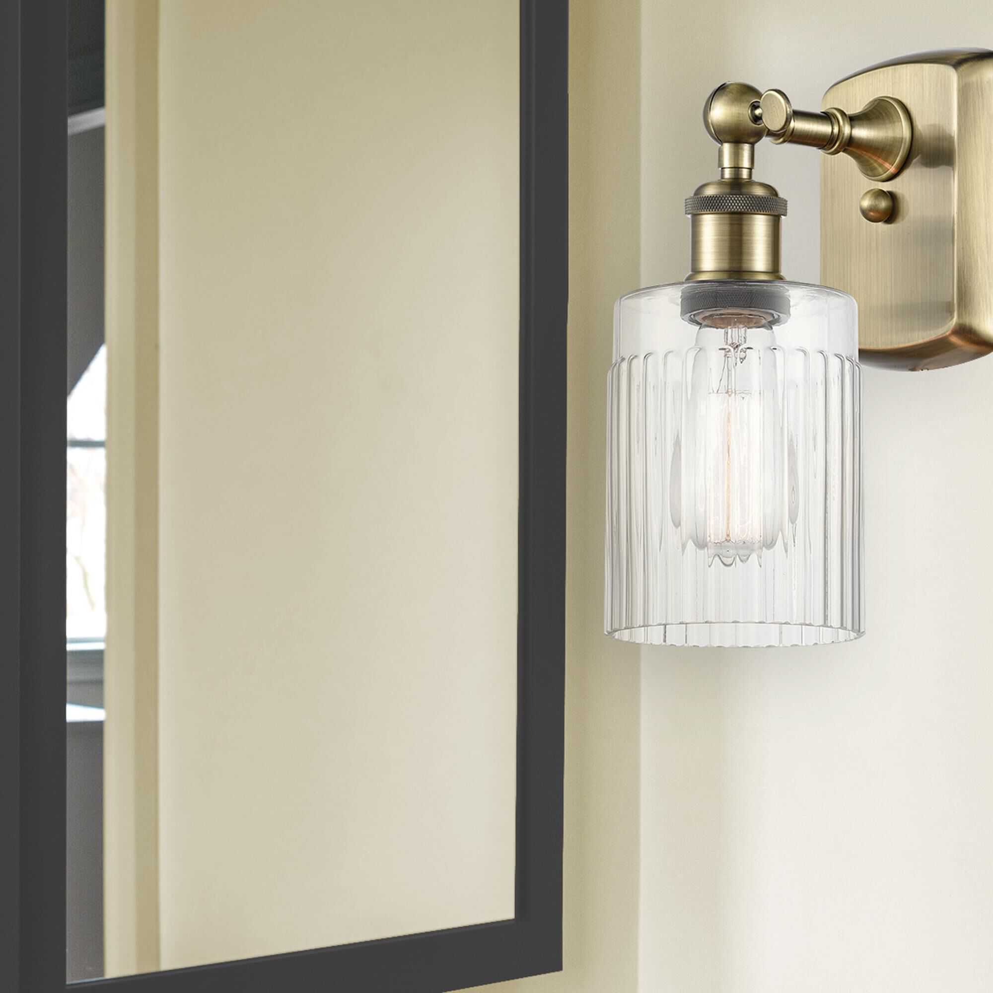 Shown in Antique Brass finish and Clear Hadley glass and None shade