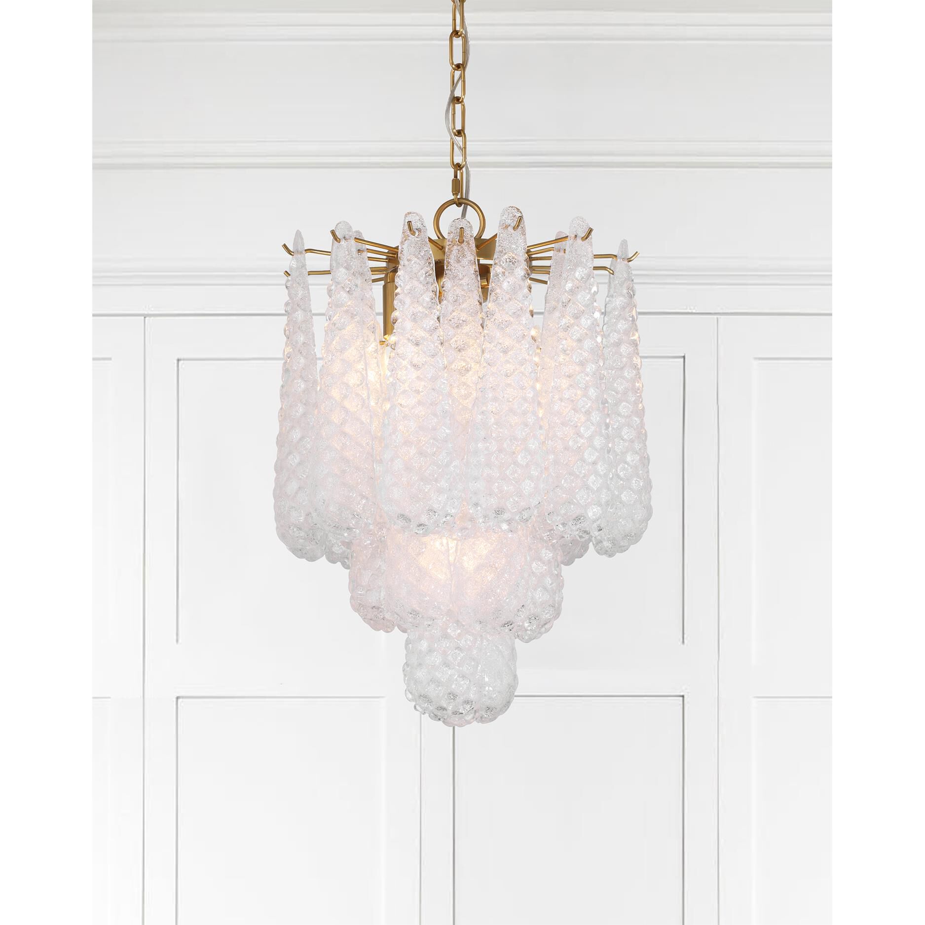 Shown in Aged Brass finish and Sand Clear glass