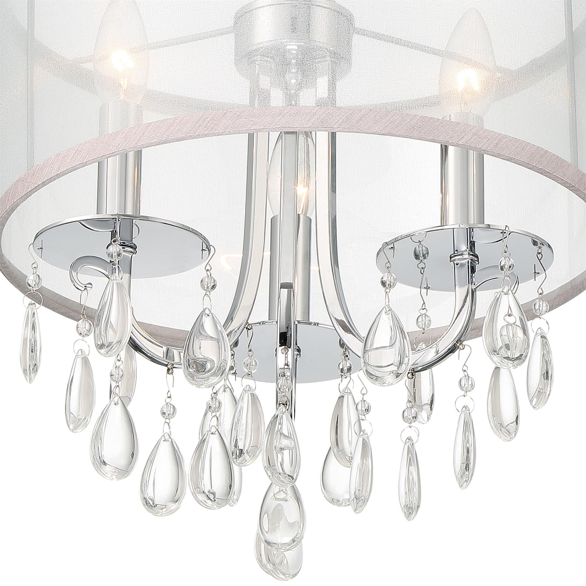 Shown in Polished Chrome finish and Clear Teardrop Almond crystal and Silk glass and Translucent Silver shade