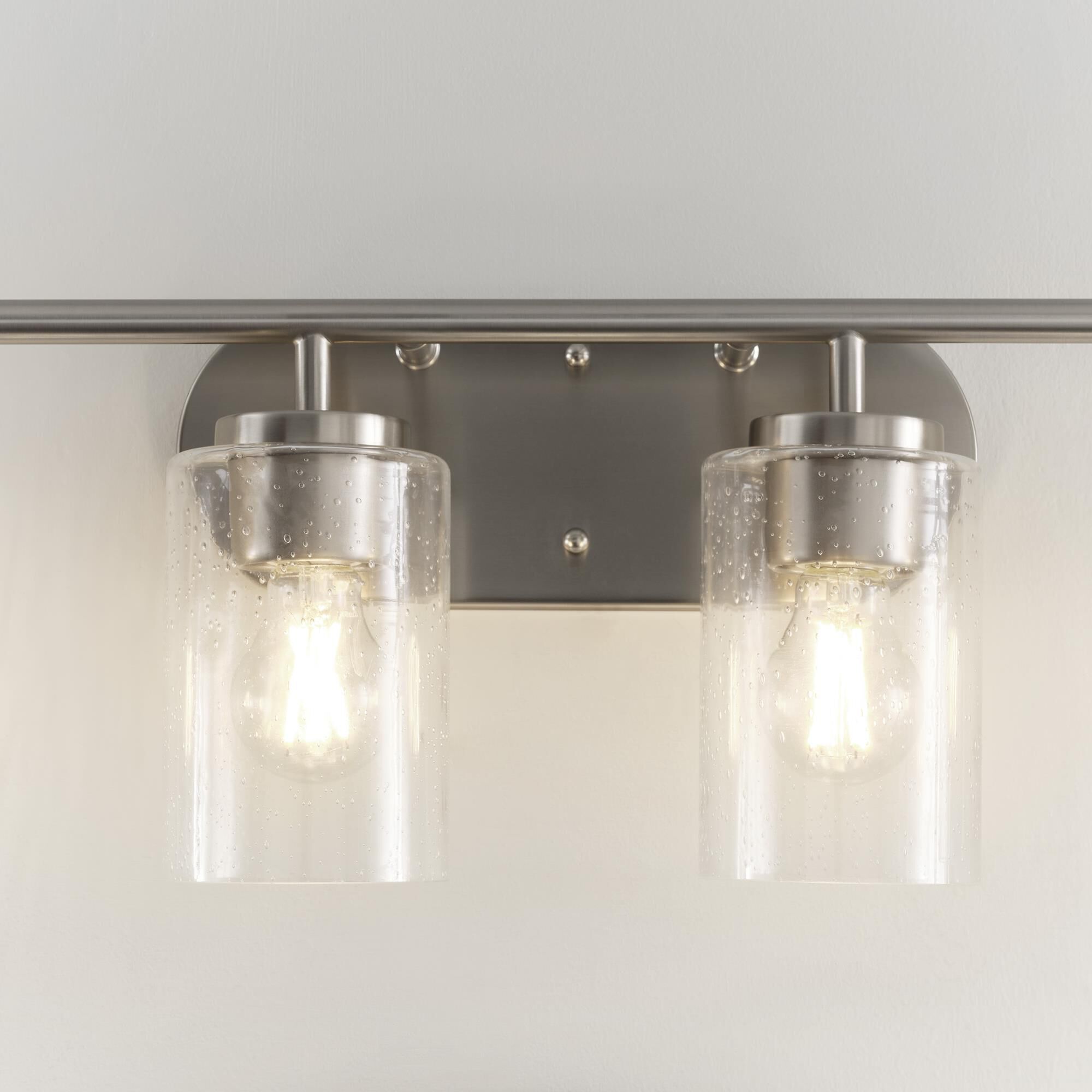 Shown in Brushed Nickel finish and Clear Seeded glass