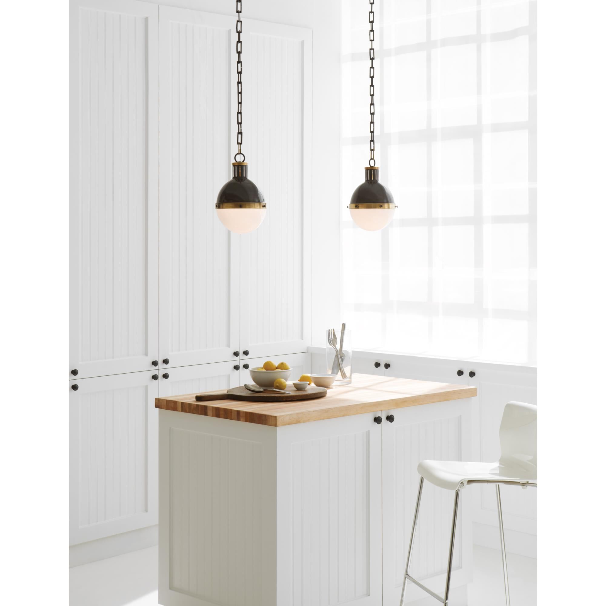 Shown in Bronze With Antique Brass finish and White glass