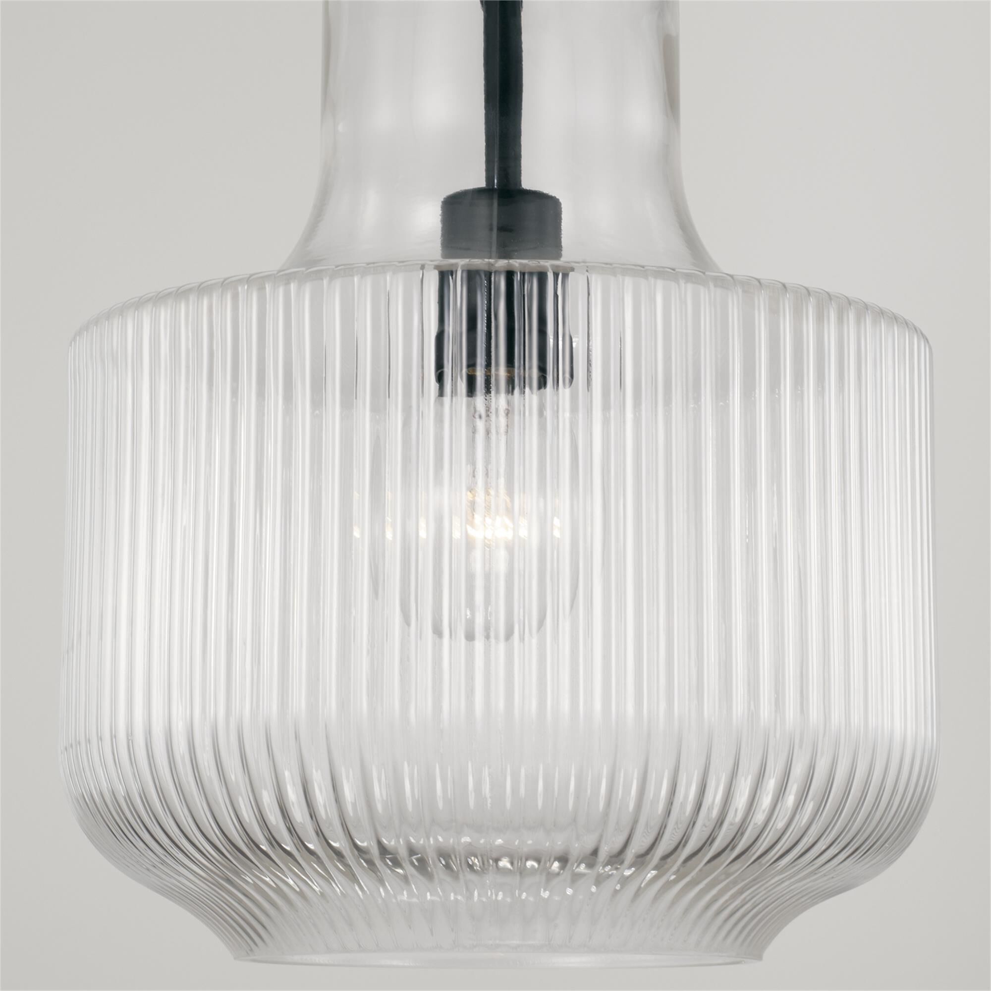 Shown in Matte Black finish and Clear Fluted glass