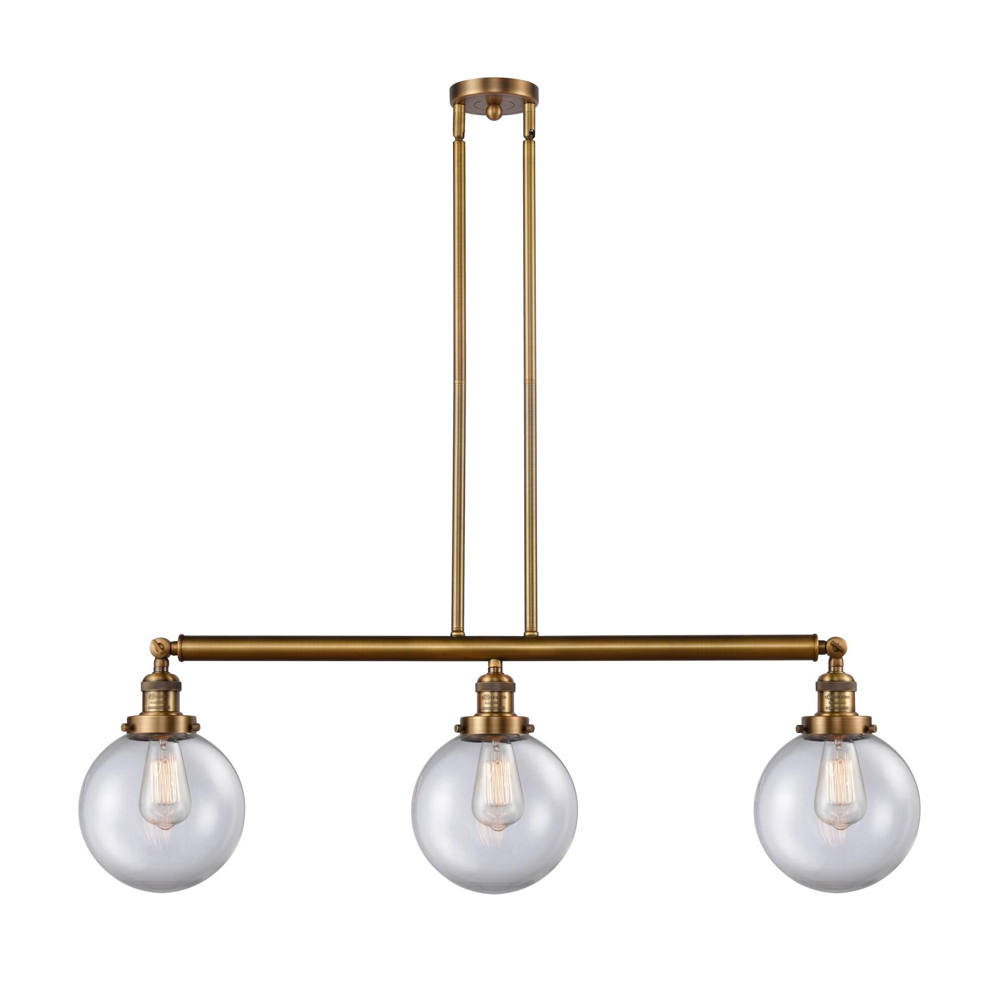 Shown in Brushed Brass finish and Clear Beacon glass