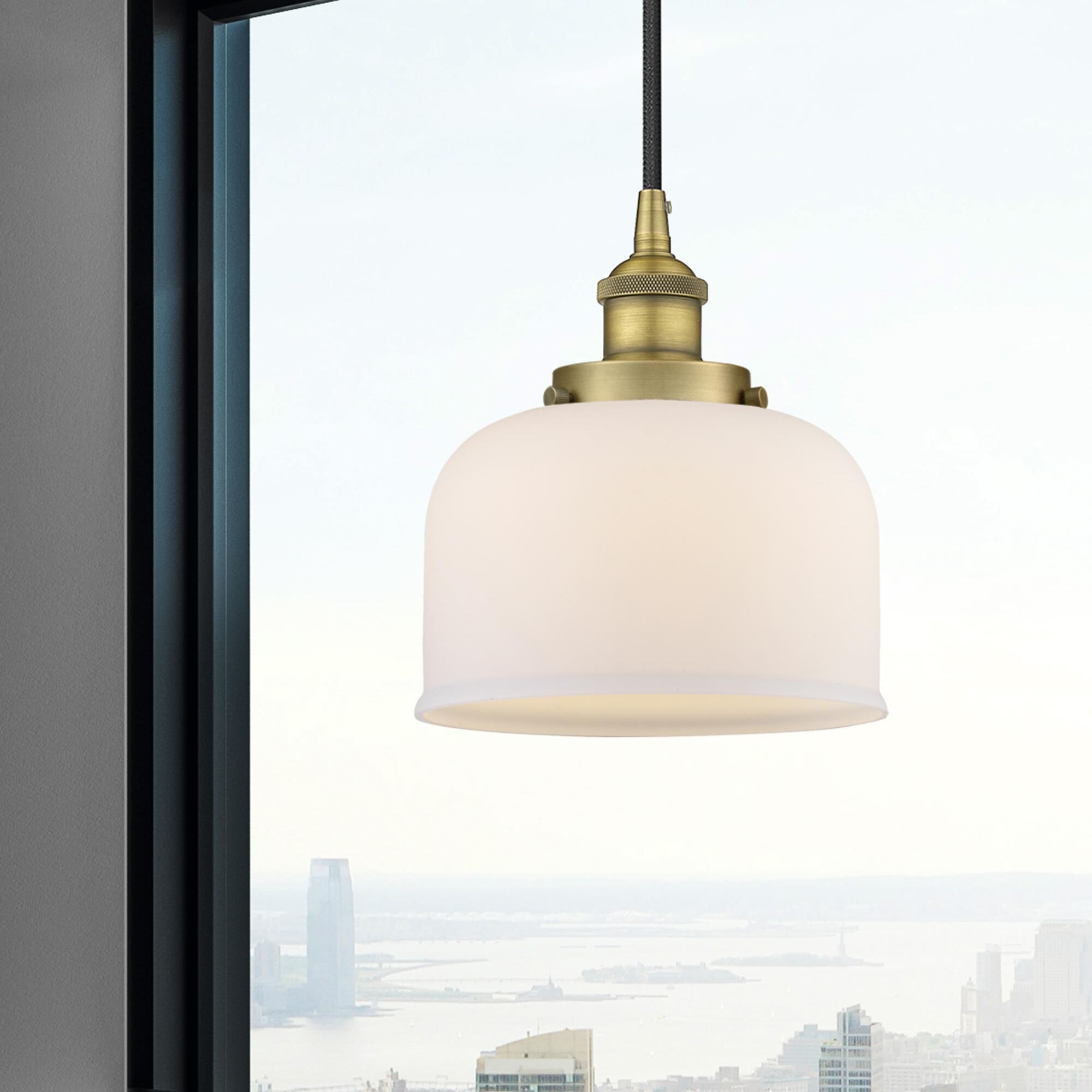 Shown in Brushed Brass finish and Matte White glass
