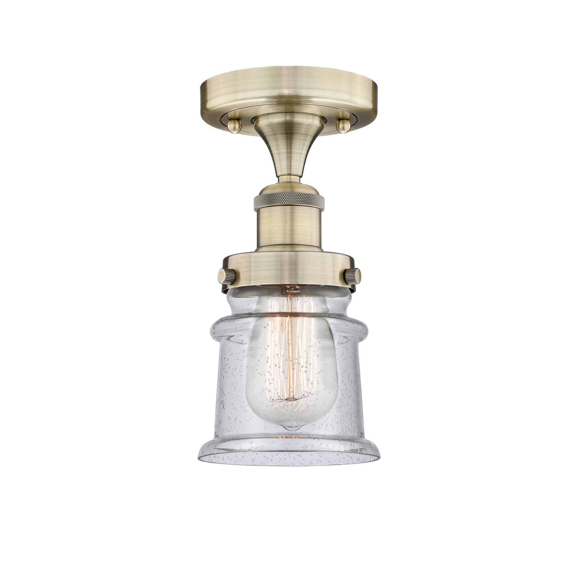 Shown in Antique Brass finish and Seedy glass