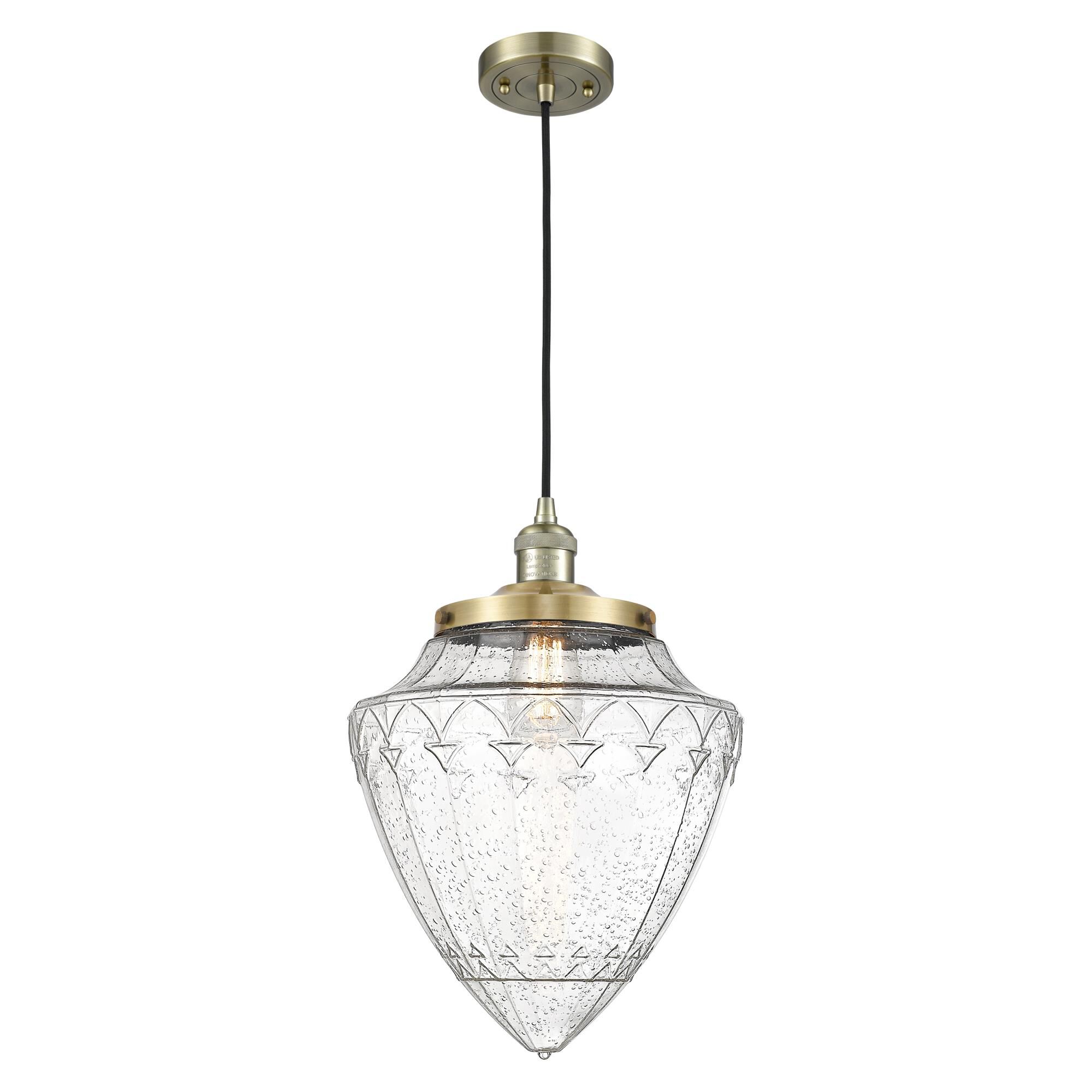 Shown in Antique Brass finish and Seedy glass