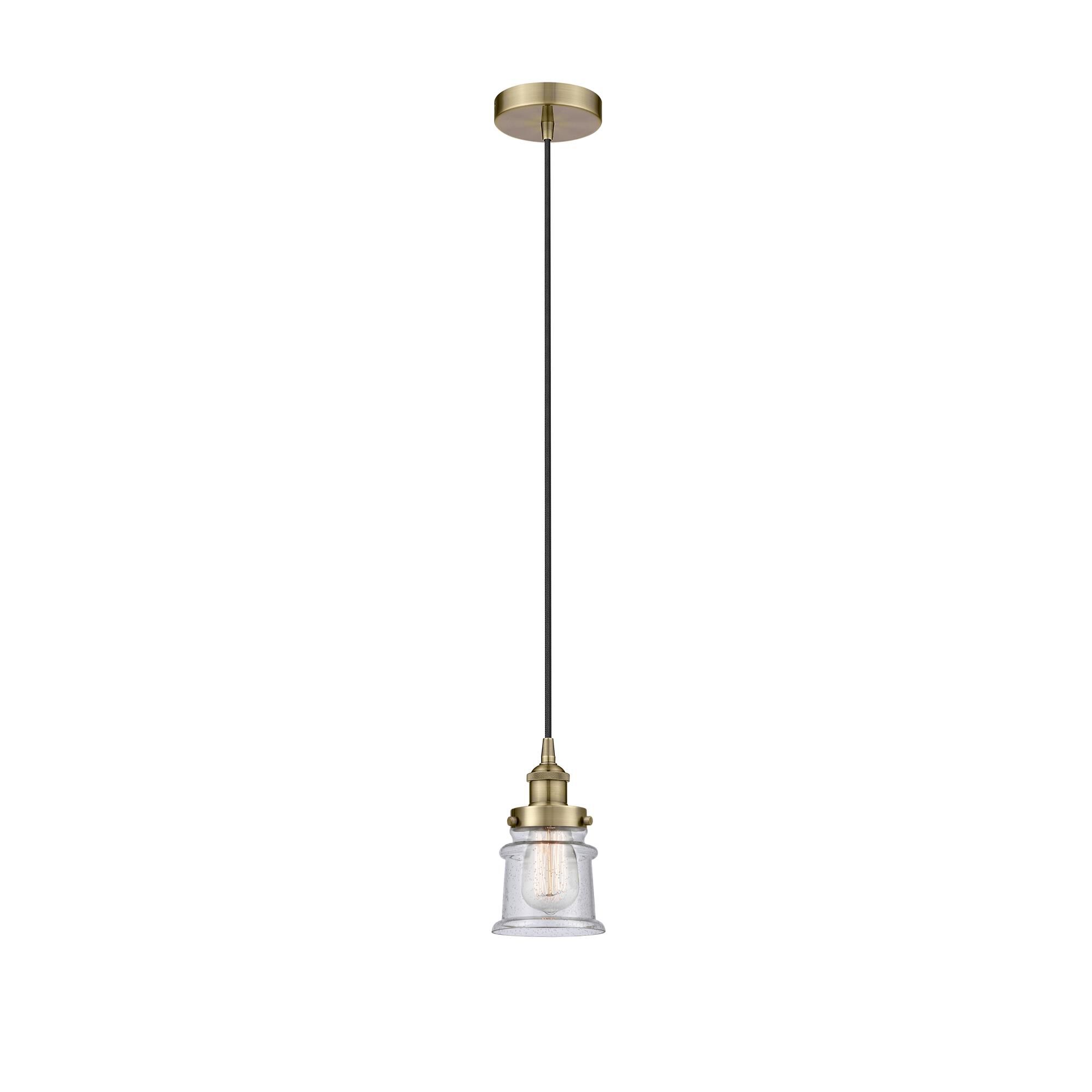 Shown in Antique Brass finish and Seedy glass