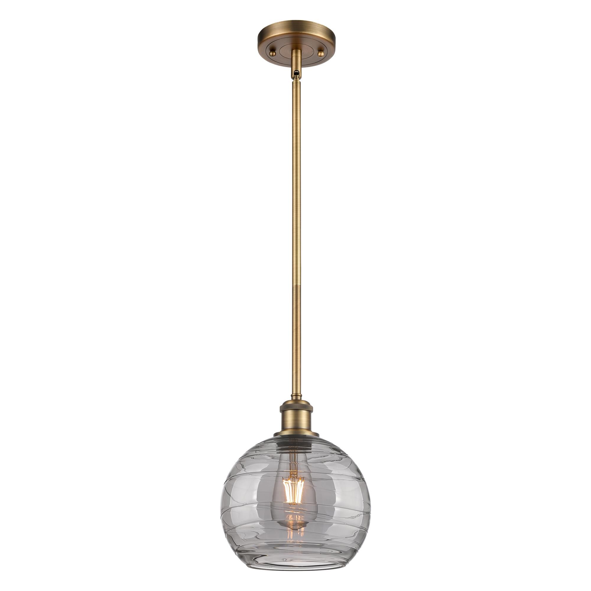 Shown in Brushed Brass finish and Light Smoke Deco Swirl glass