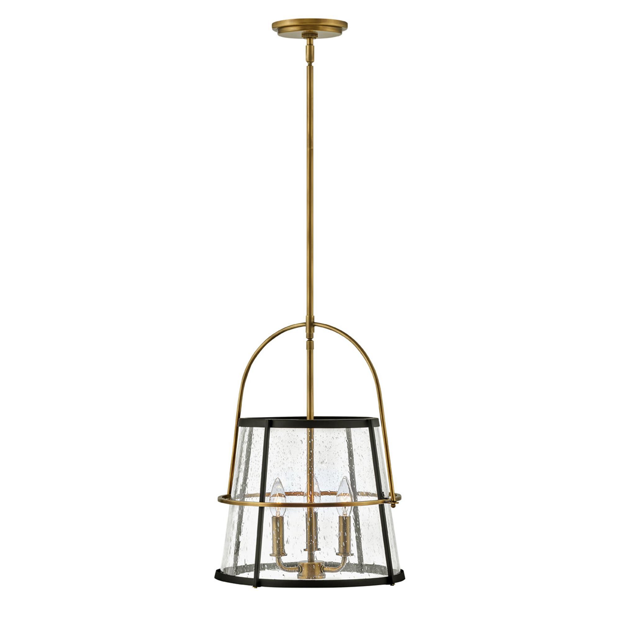 Shown in Heritage Brass finish and Clear Seedy glass and Black accent