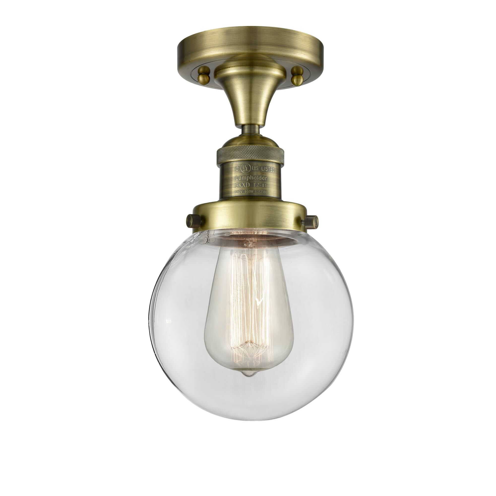 Shown in Antique Brass finish and Clear glass