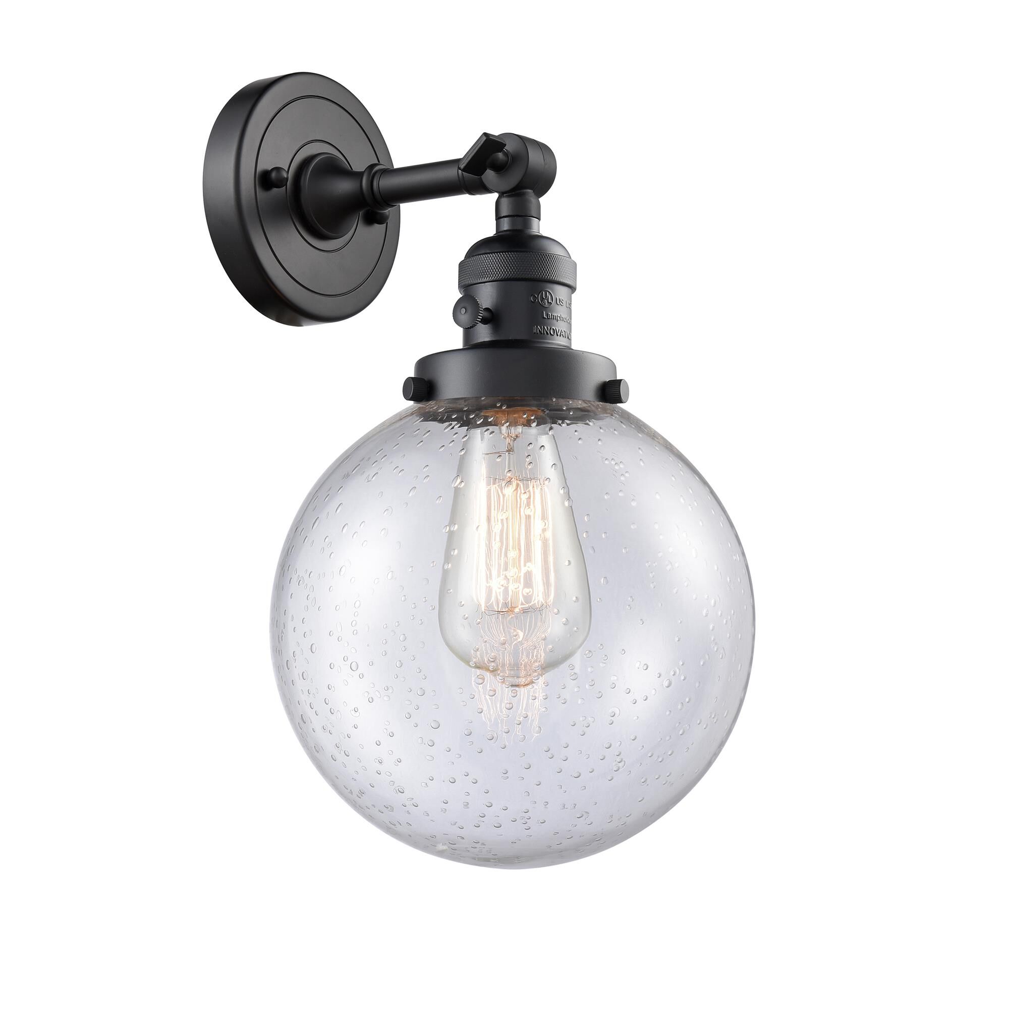 Shown in Matte Black finish and Seedy glass and Switch on Socket accent