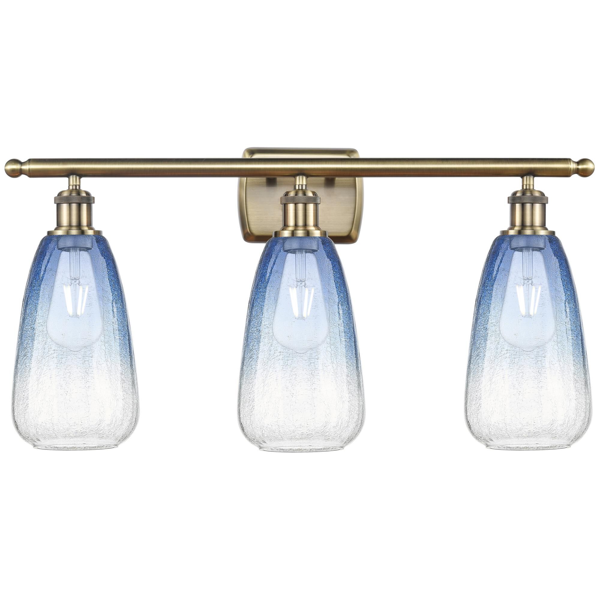 Shown in Antique Brass finish and Sapphire Blue glass
