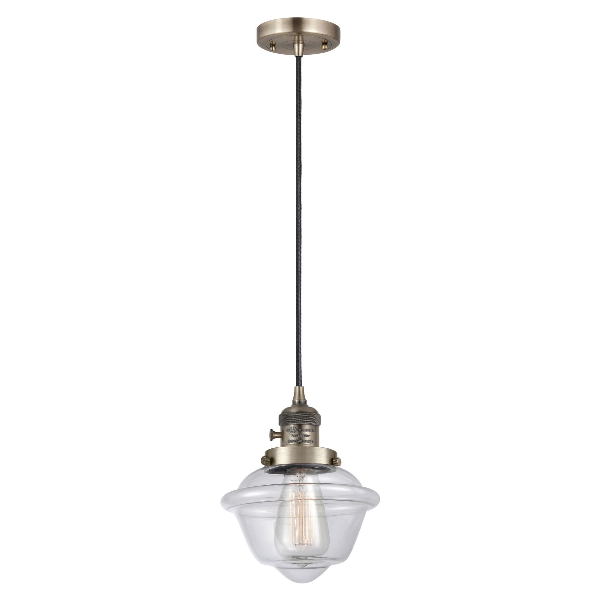 Shown in Antique Brass finish and Clear glass