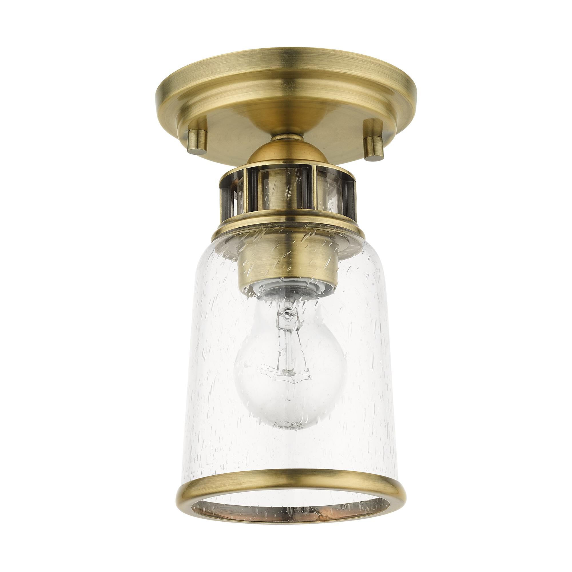 Shown in Antique Brass finish and Hand Blown Clear Seeded glass