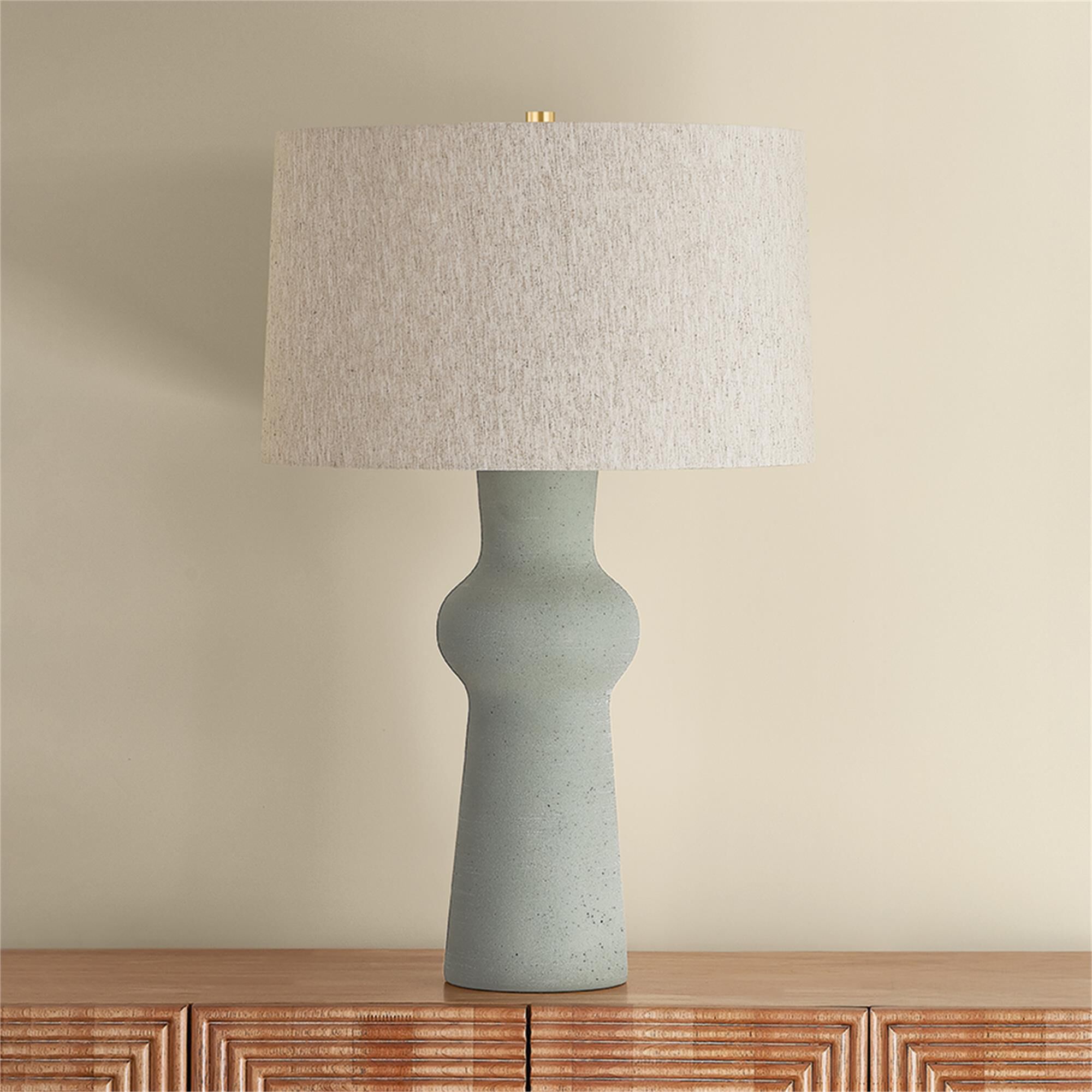 Shown in Aged Brass and Ceramic Hazy Jade finish and Natural Linen shade