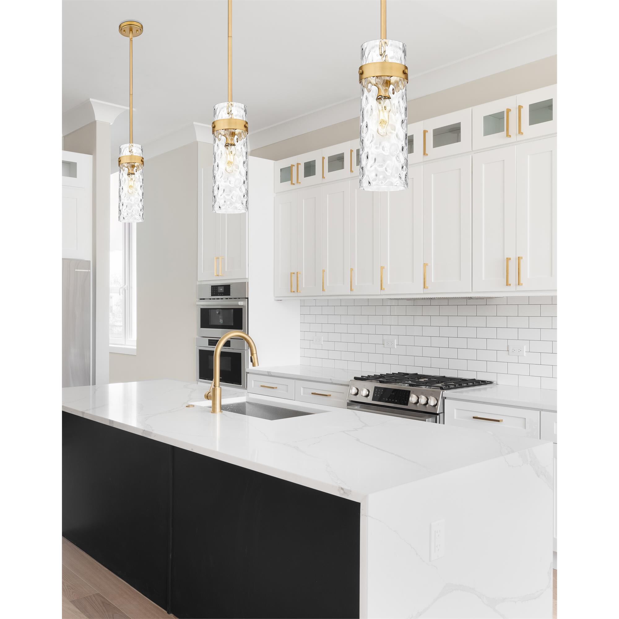 Shown in Rubbed Brass finish and Clear Water glass and Clear Water shade
