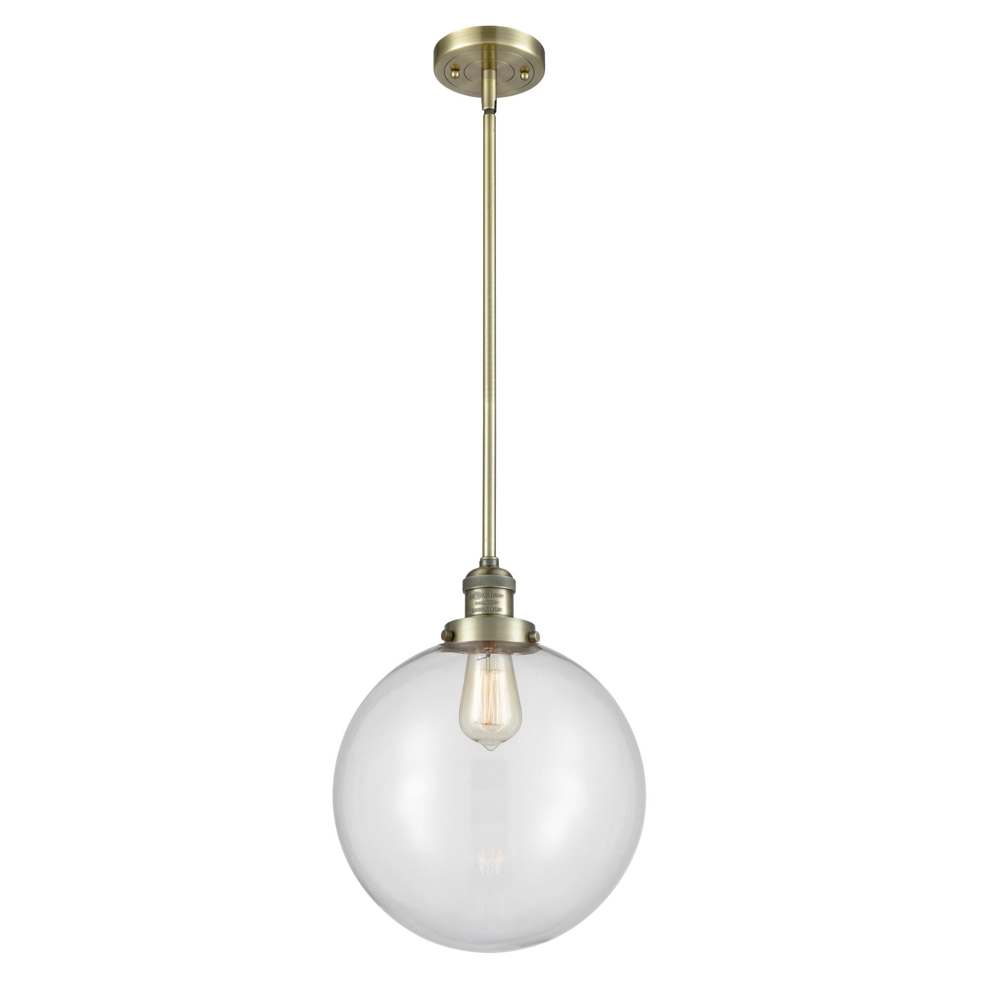 Shown in Antique Brass finish and Clear Beacon glass