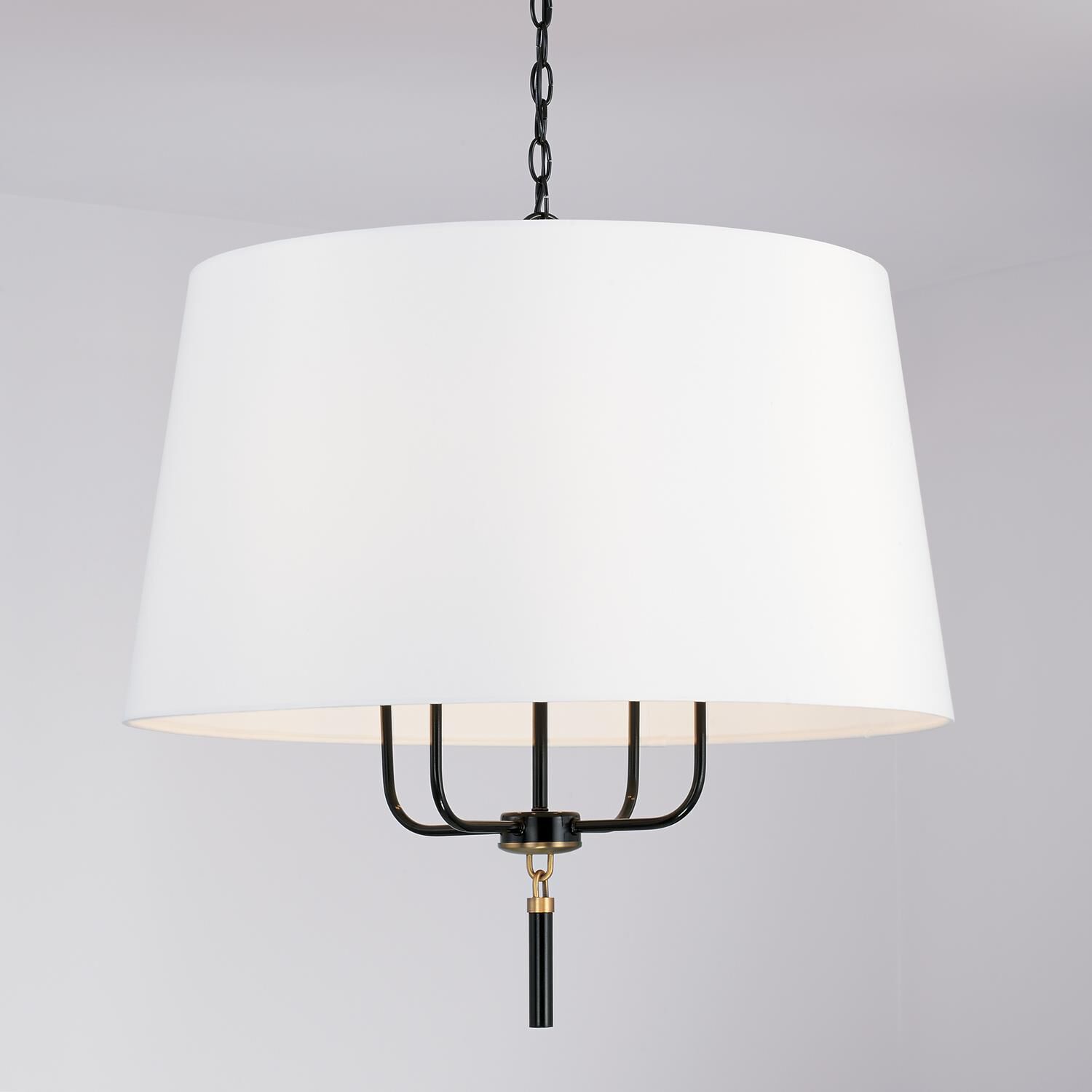 Shown in Glossy Black And Aged Brass finish and White Fabric shade