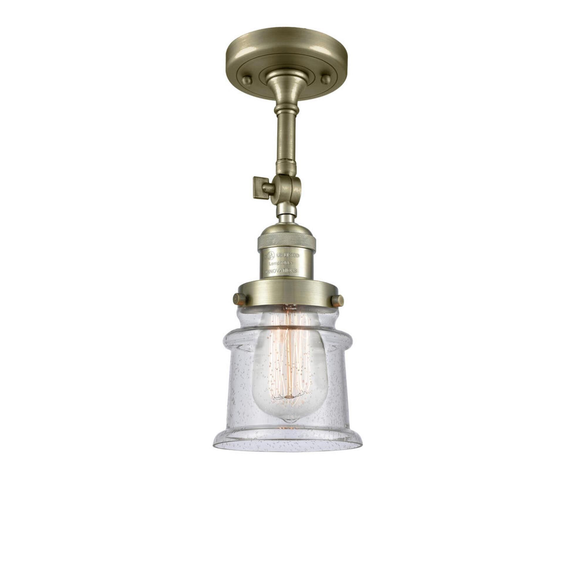 Shown in Antique Brass finish and Seedy glass and None accent