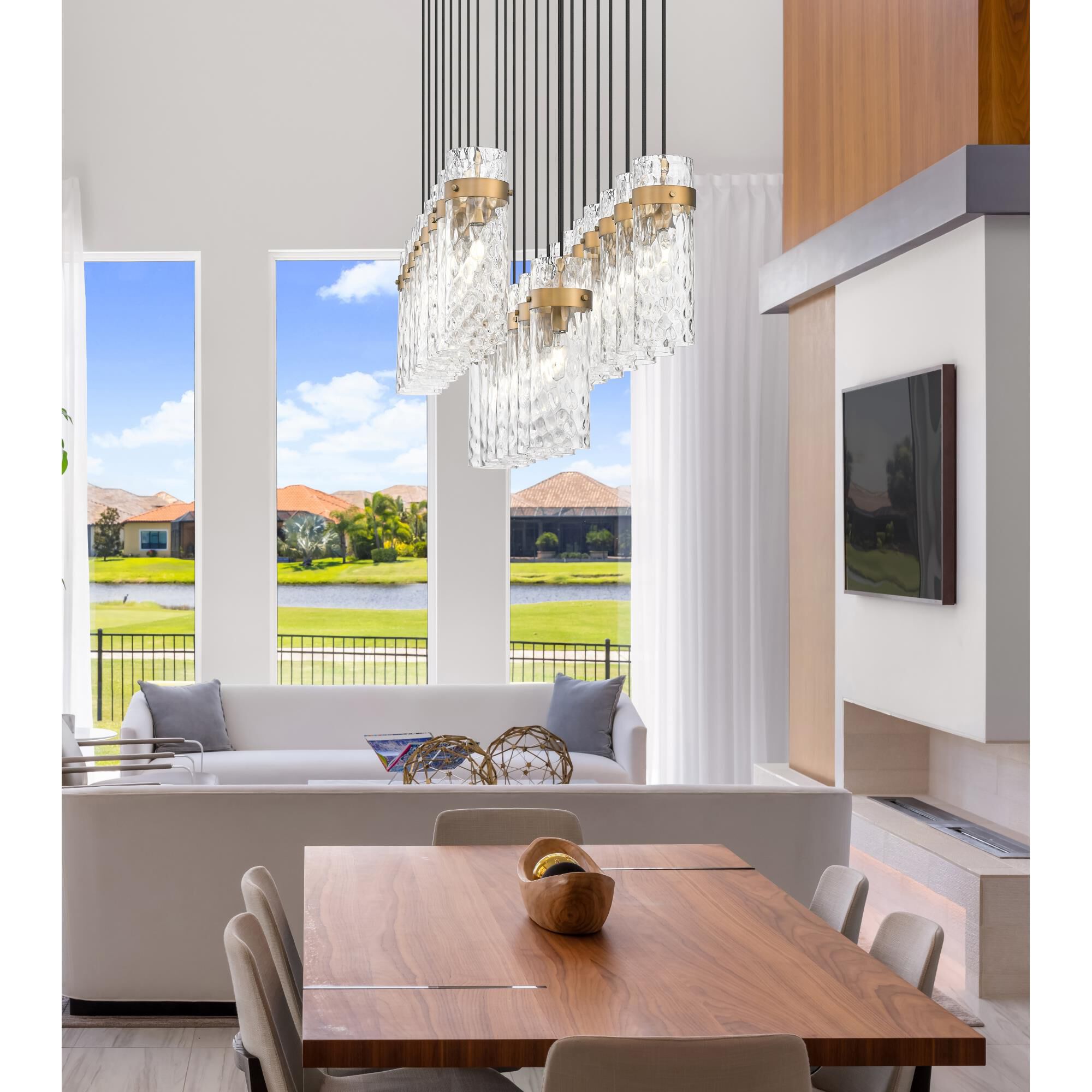 Shown in Rubbed Brass finish and Clear Water glass and Clear Water shade