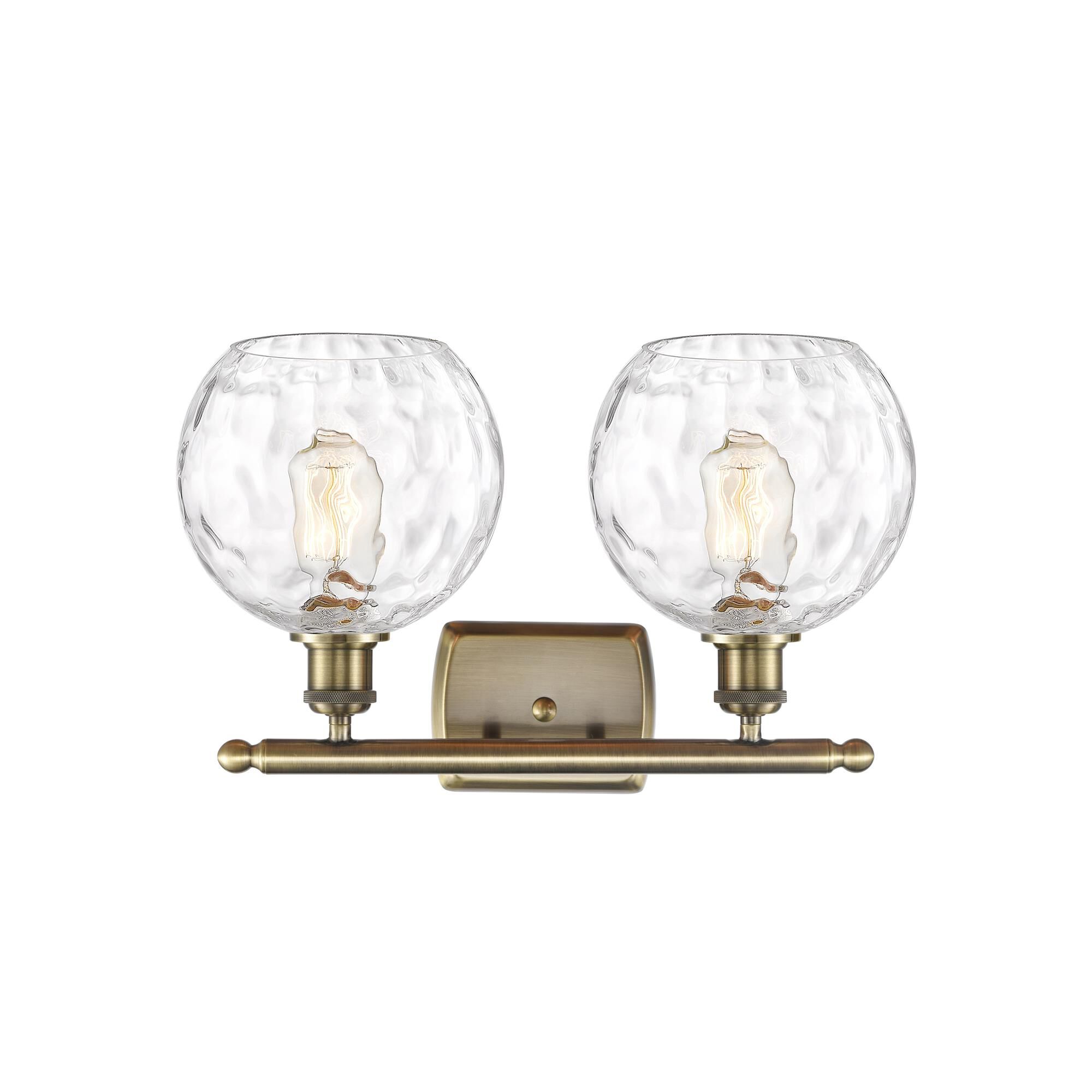 Shown in Antique Brass finish and Clear glass