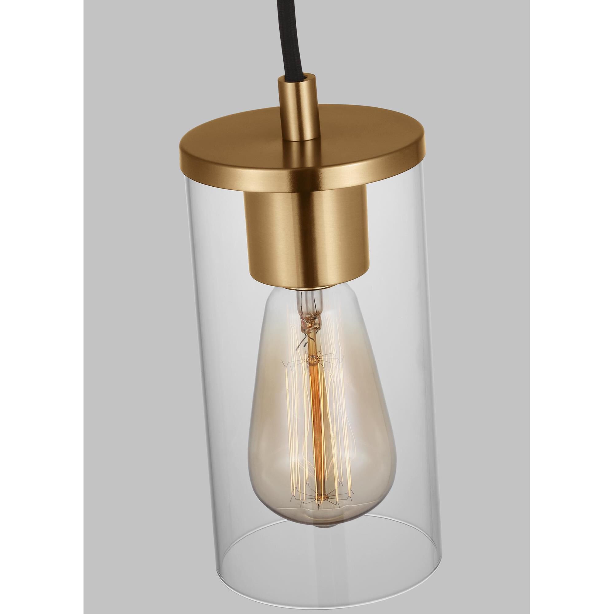 Shown in Satin Brass finish and Clear Glass shade