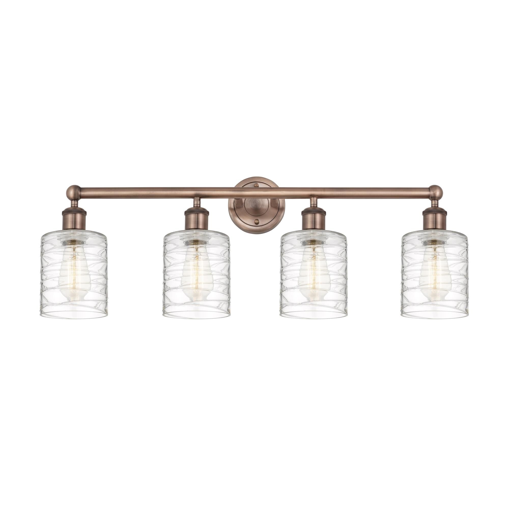 Shown in Antique Copper finish and Deco Swirl glass