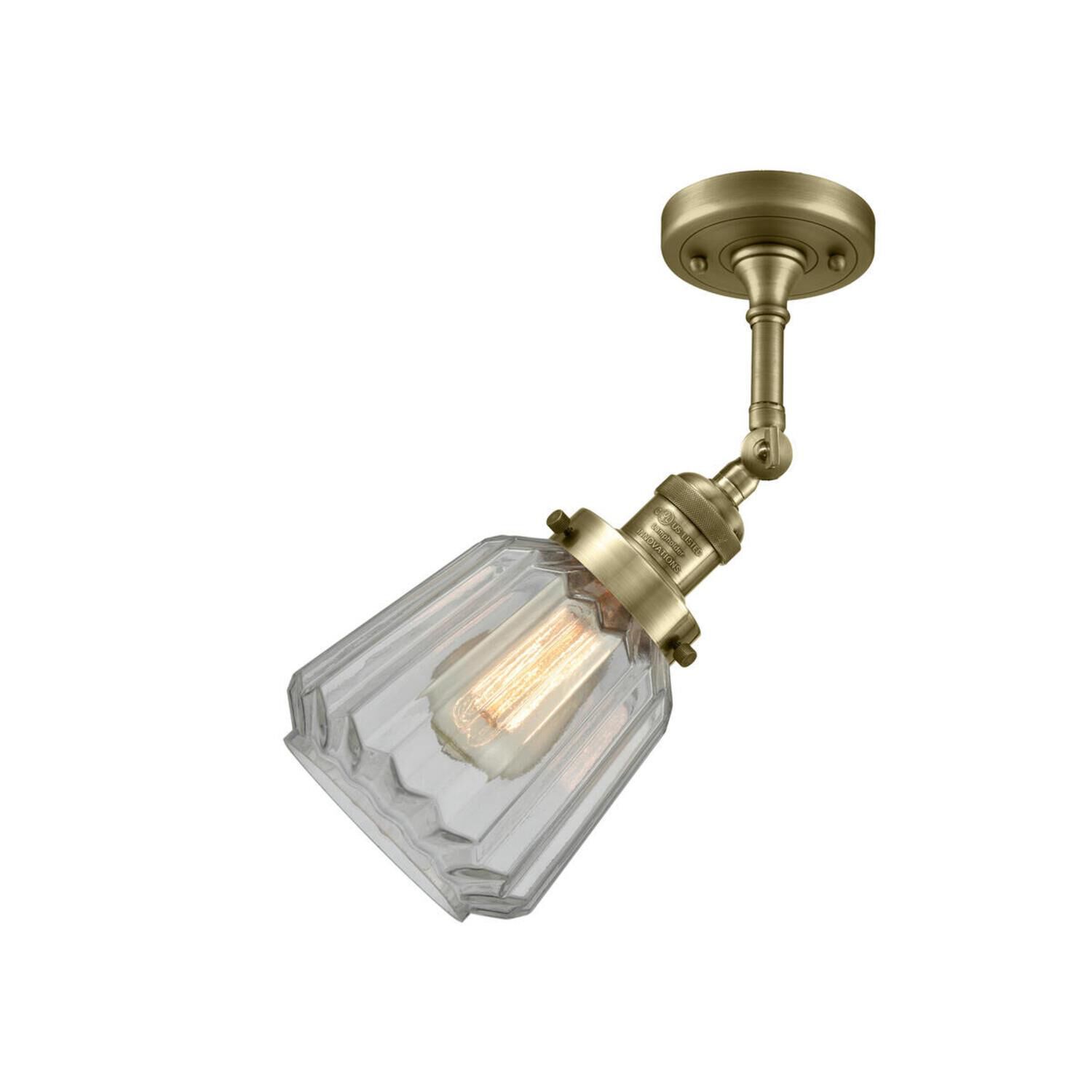 Shown in Antique Brass finish and Clear glass and None accent