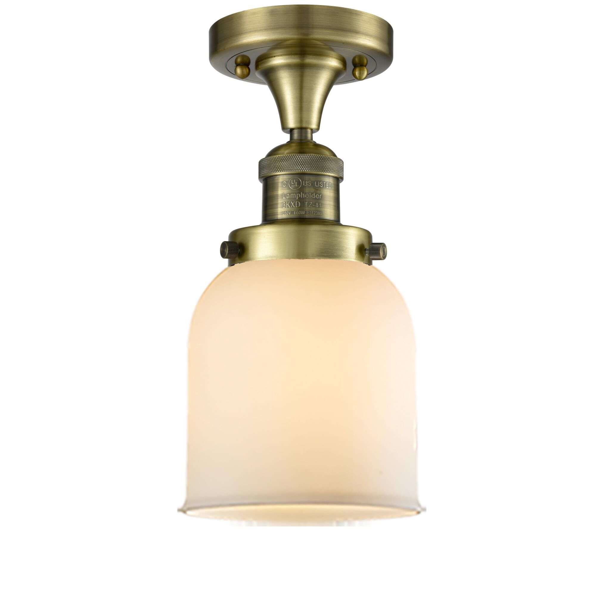 Shown in Antique Brass finish and Matte White Cased glass
