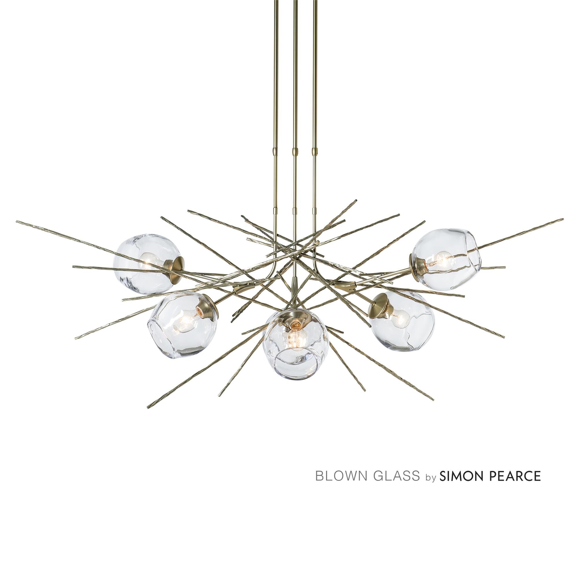 Shown in Modern Brass finish and Clear shade