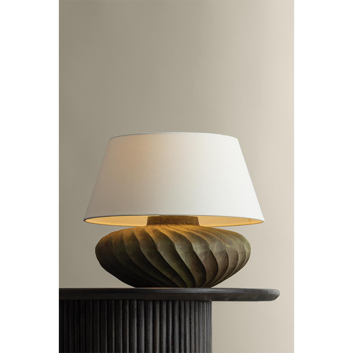 Shown in Patina Brass finish and Off White Linen shade