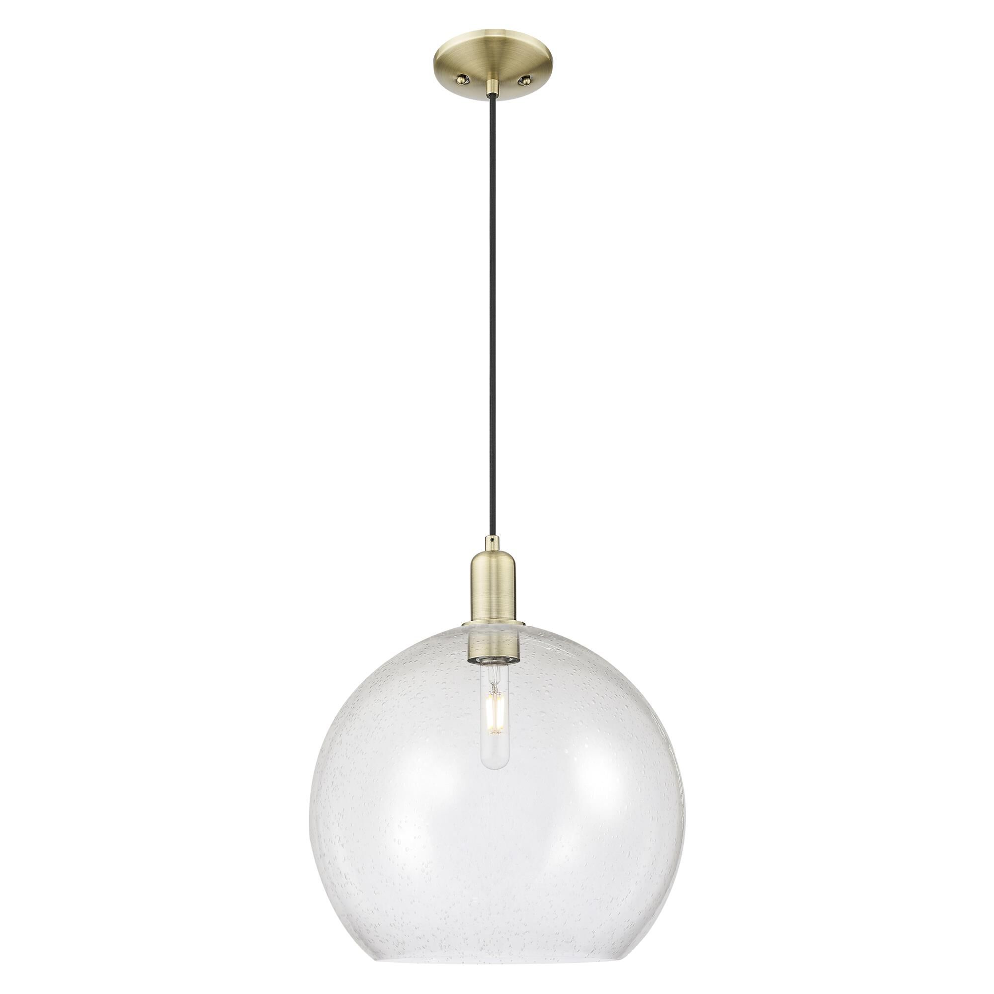 Shown in Antique Brass finish and Seedy glass