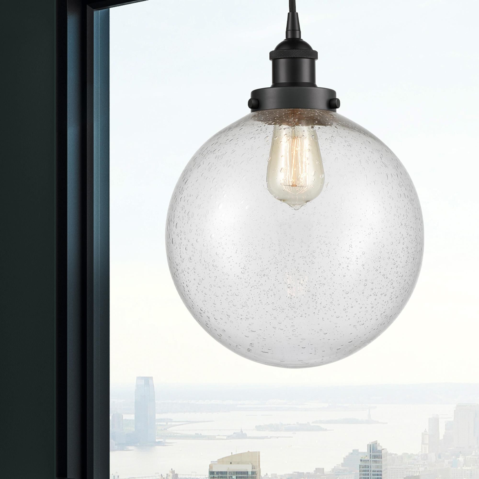 Shown in Matte Black finish and Seedy Beacon glass