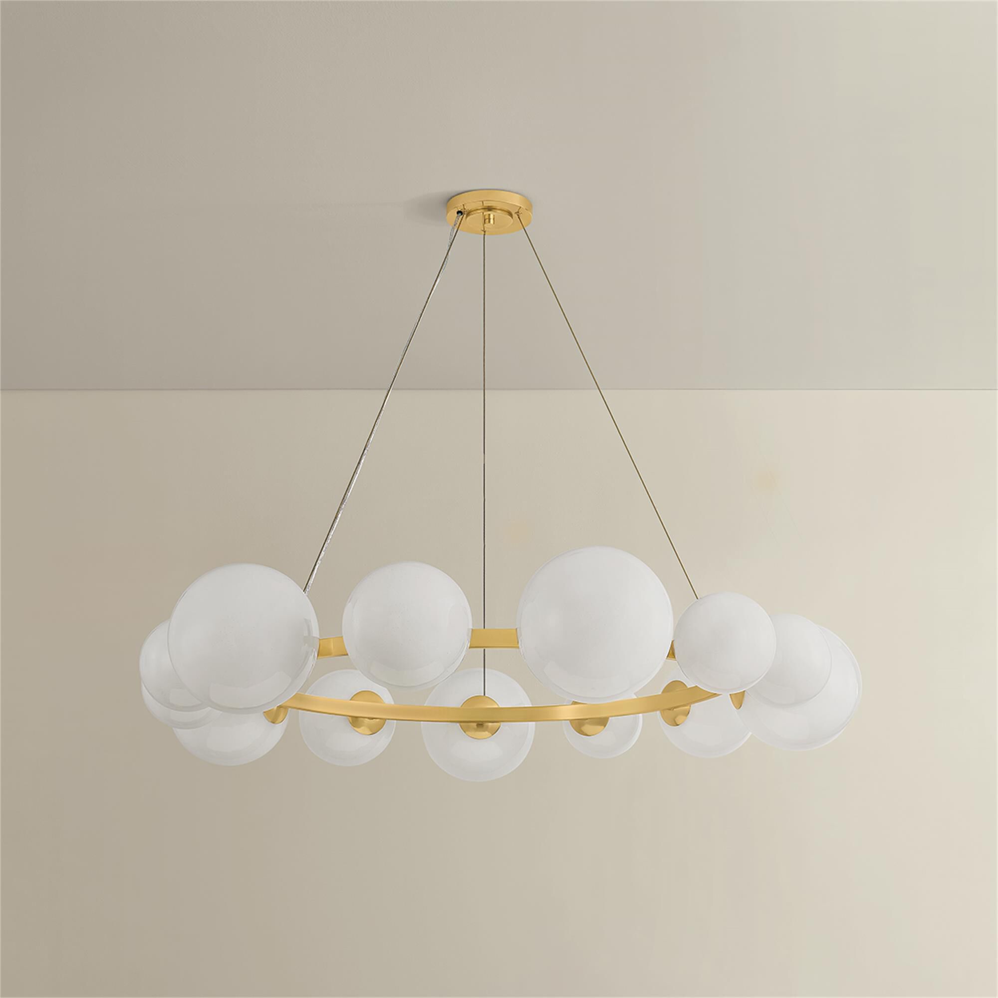 Shown in Aged Brass finish and Seeded Cloud glass
