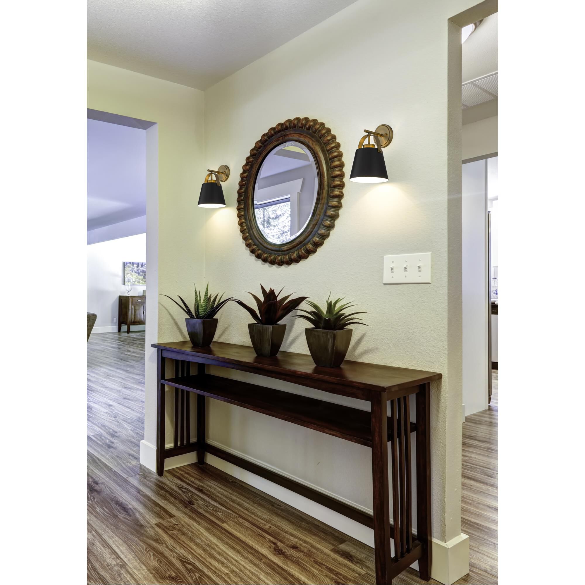 Shown in Matte Black and Heritage Brass finish and Steel shade