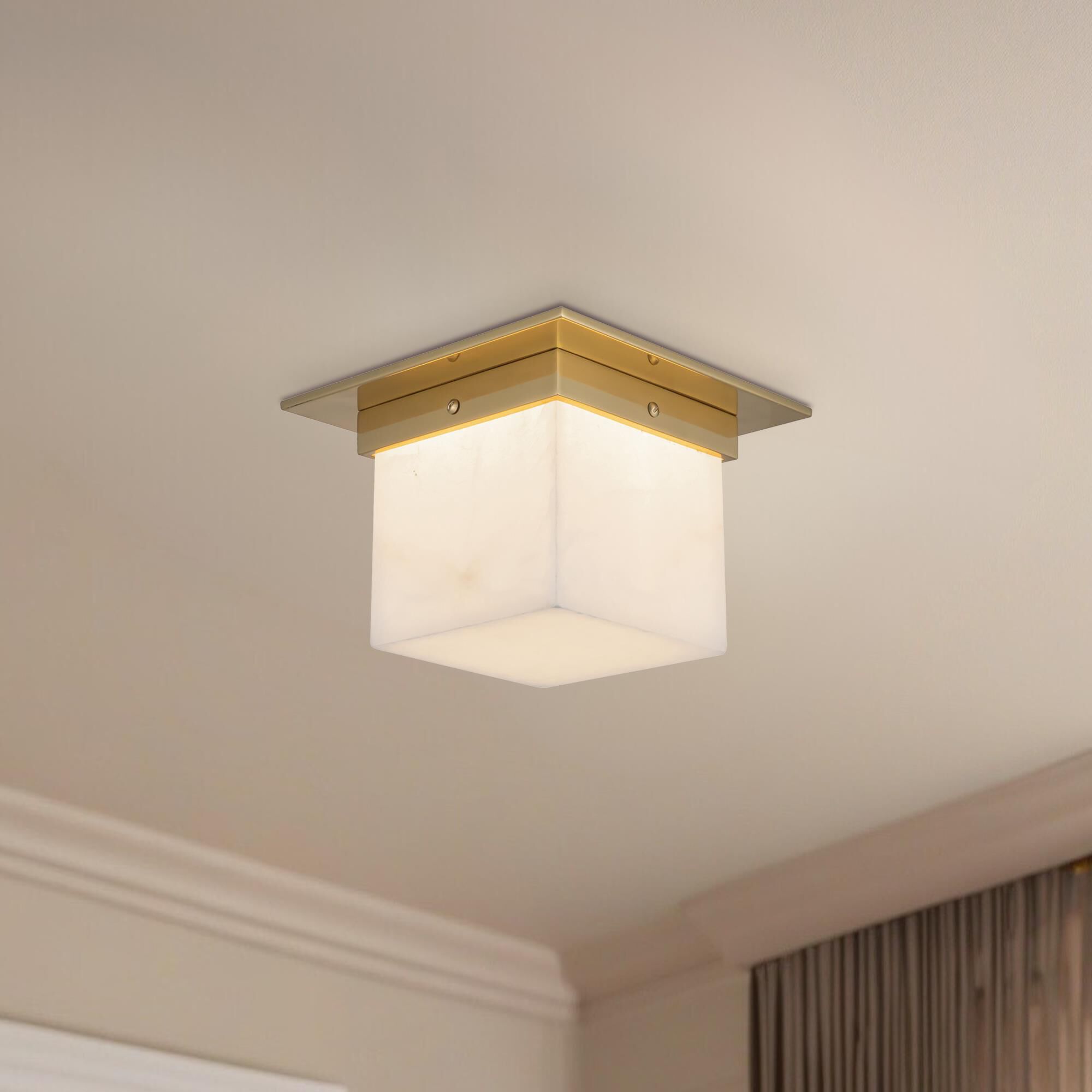 Shown in Patina Brass finish and Alabaster glass