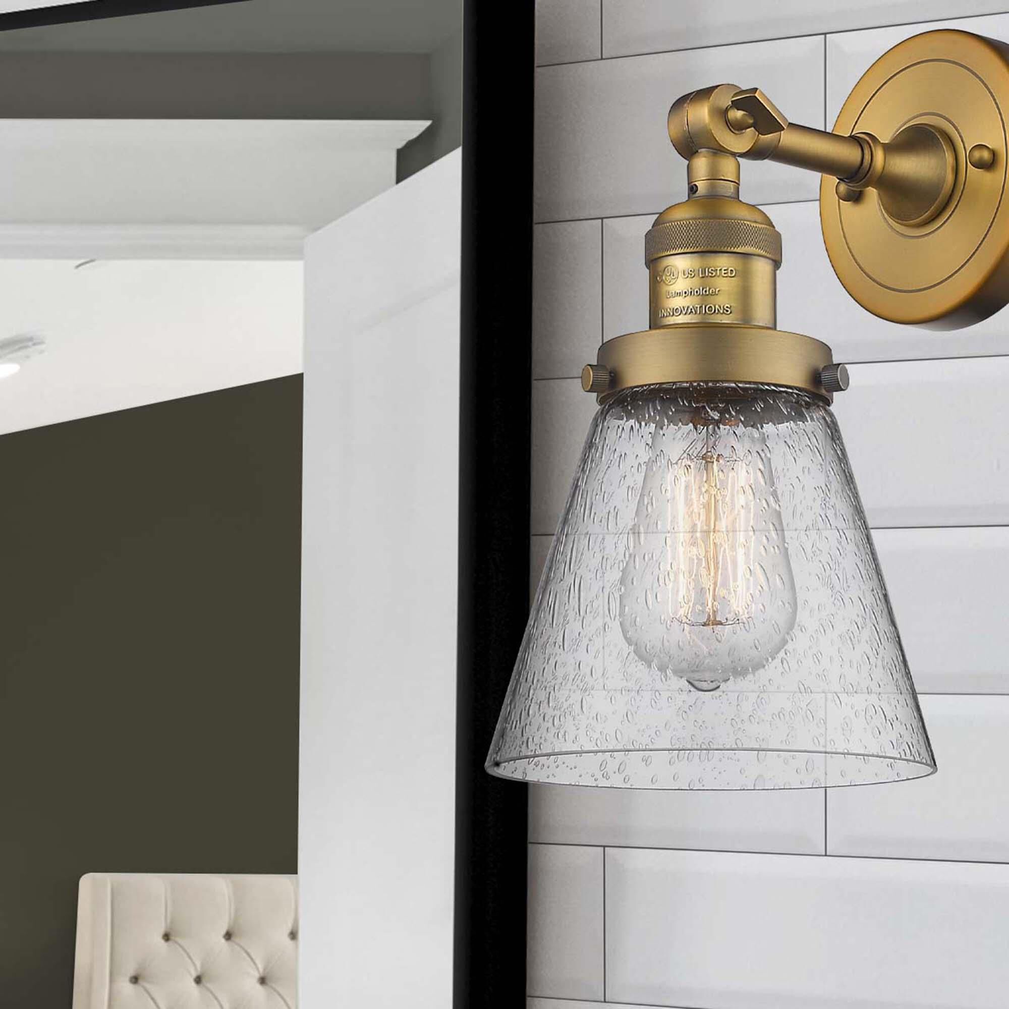 Shown in Brushed Brass finish and Seedy glass