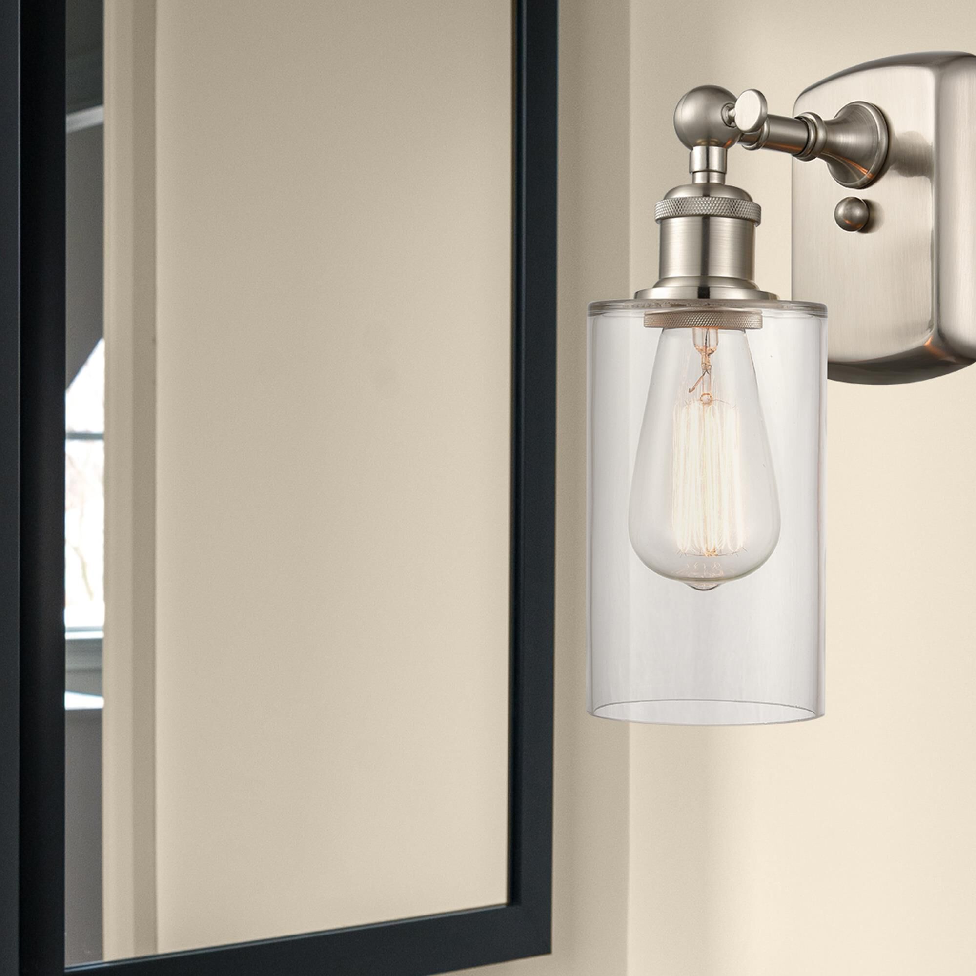 Shown in Brushed Satin Nickel finish and Drum glass and Glass shade and Polished Chrome accent