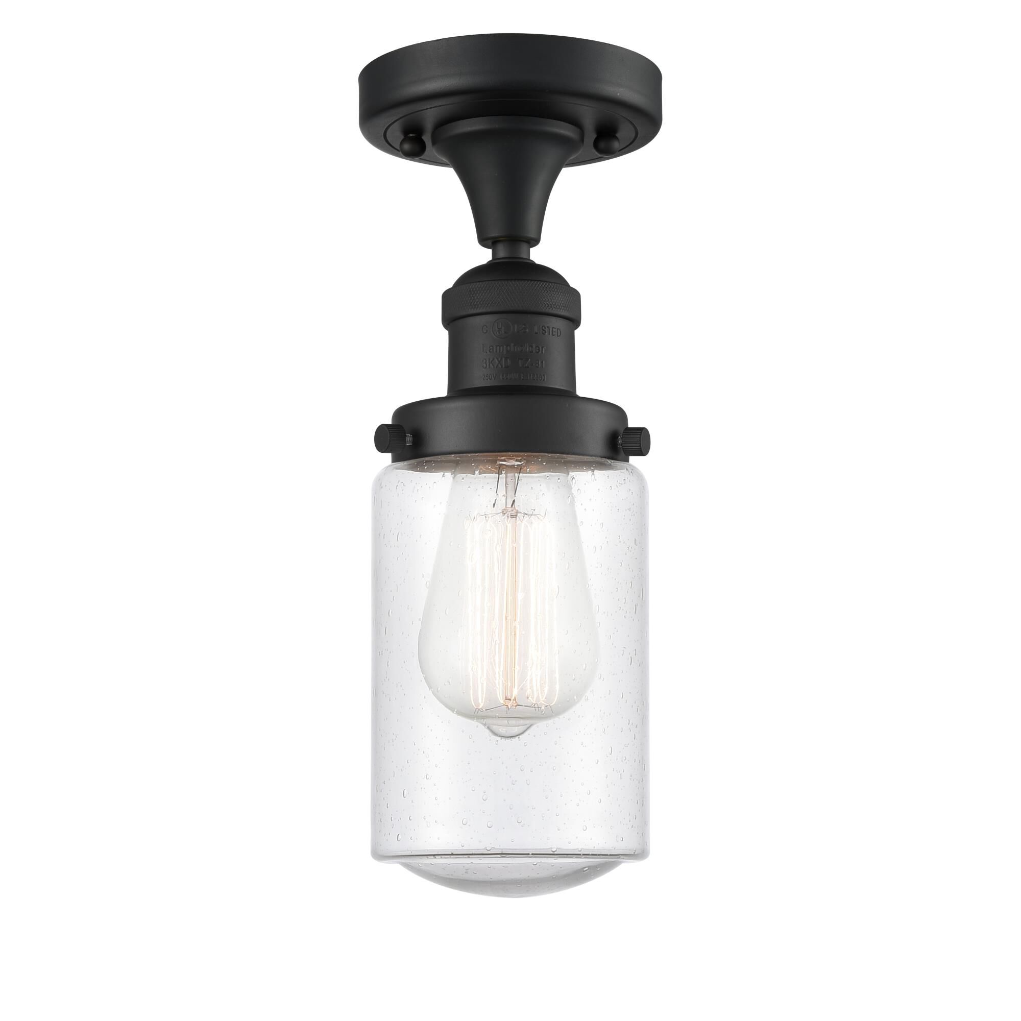 Shown in Matte Black finish and Seeded Seedy Dover glass and Bulb Tint - Amber accent
