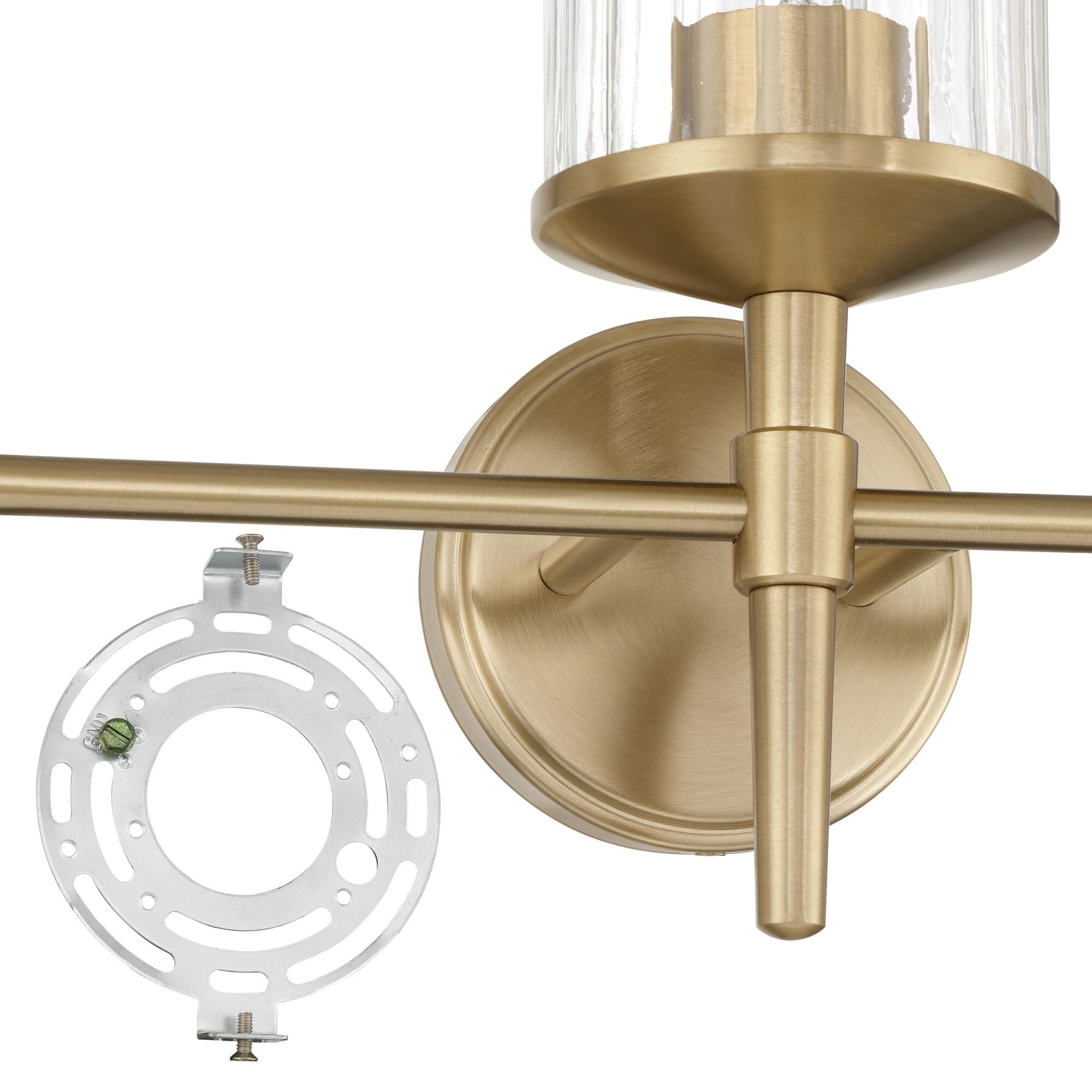 Shown in Champagne Gold finish and Clear Ribbed glass