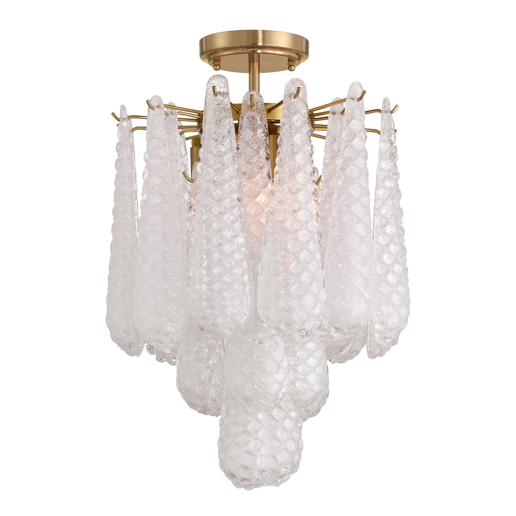 Shown in Aged Brass finish and Sand Clear glass