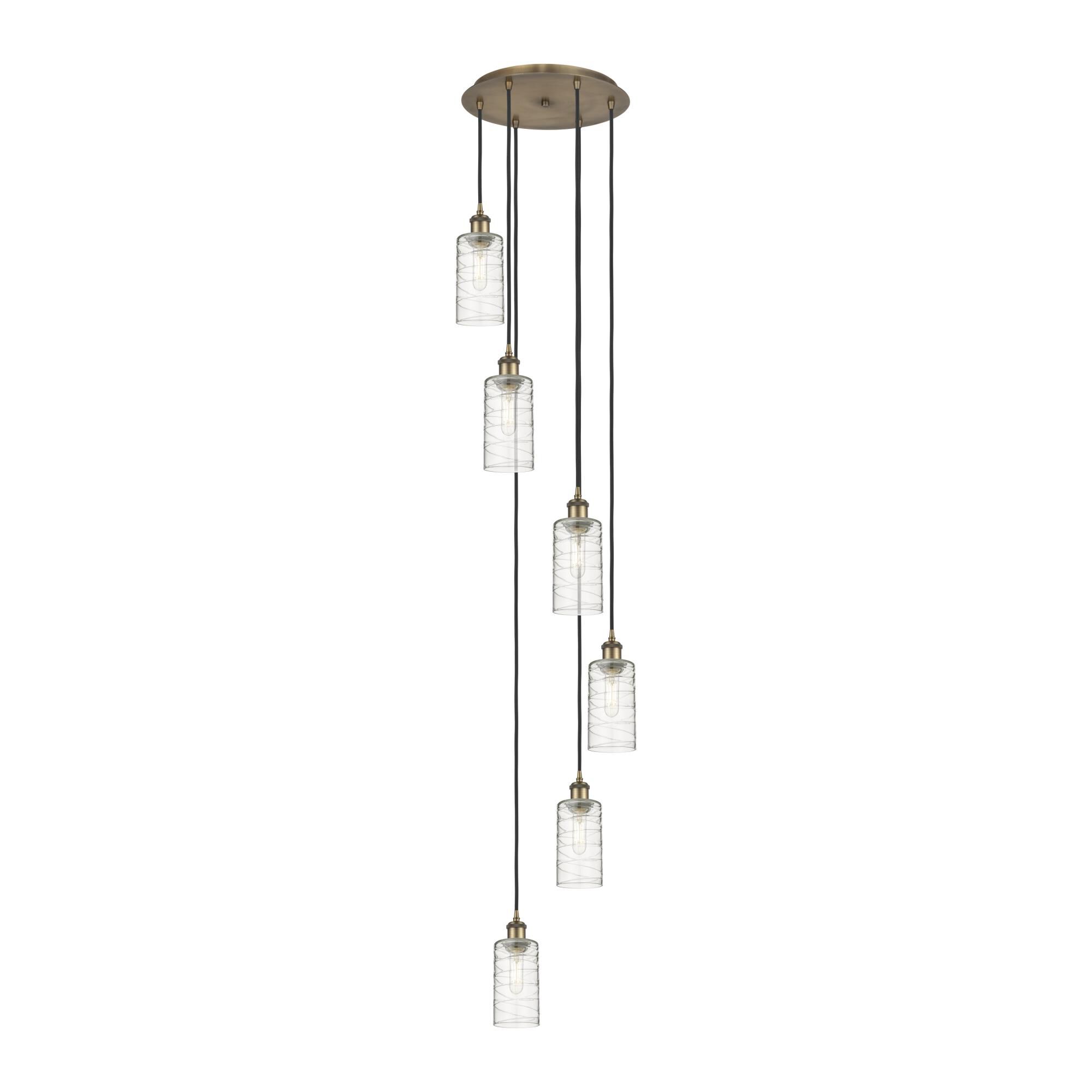 Shown in Brushed Brass finish and Deco Swirl shade