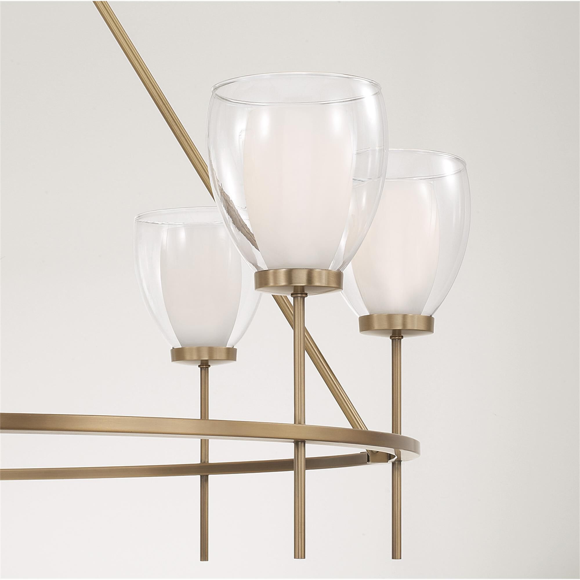 Shown in Aged Brass finish and Layered White And Clear glass