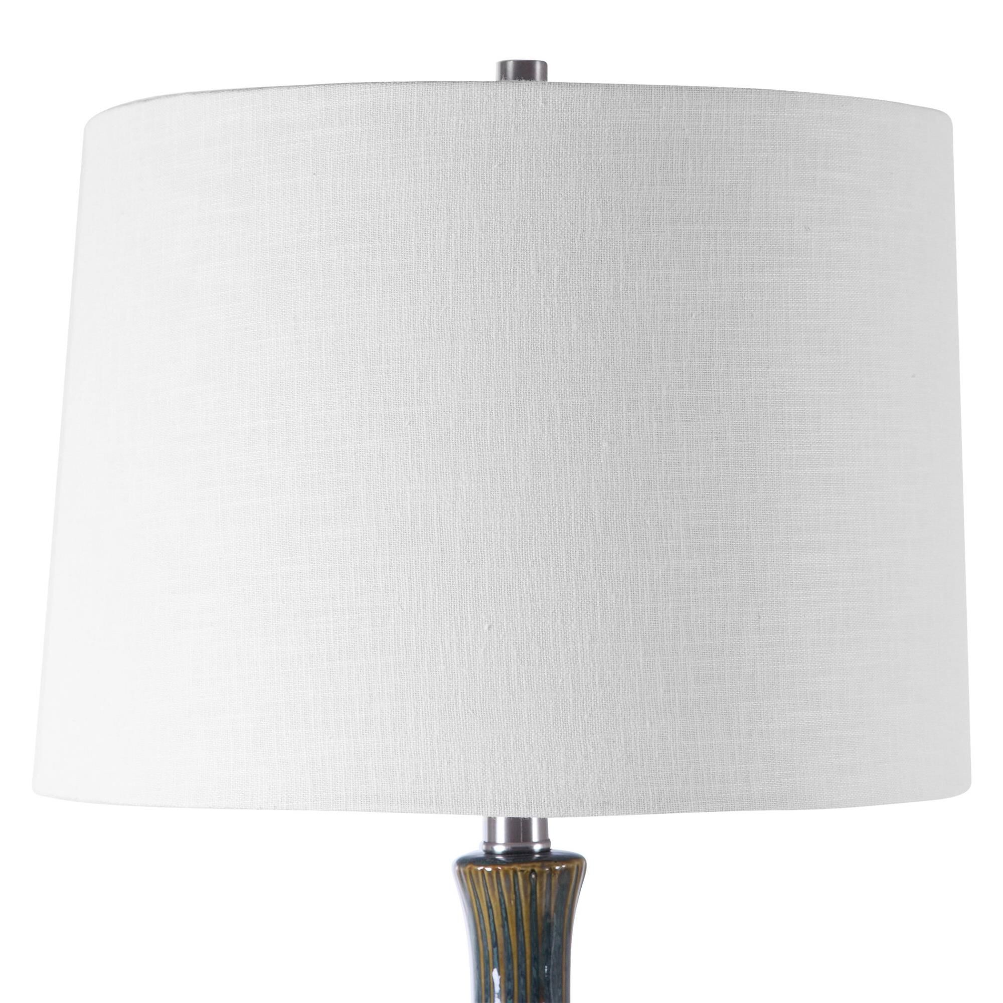 Shown in Mid-Century Inspired Table Lamp Has A Fluted Ceramic Base With Noticeable Ribbed Texture And Is Fini finish and Round Hardback shade